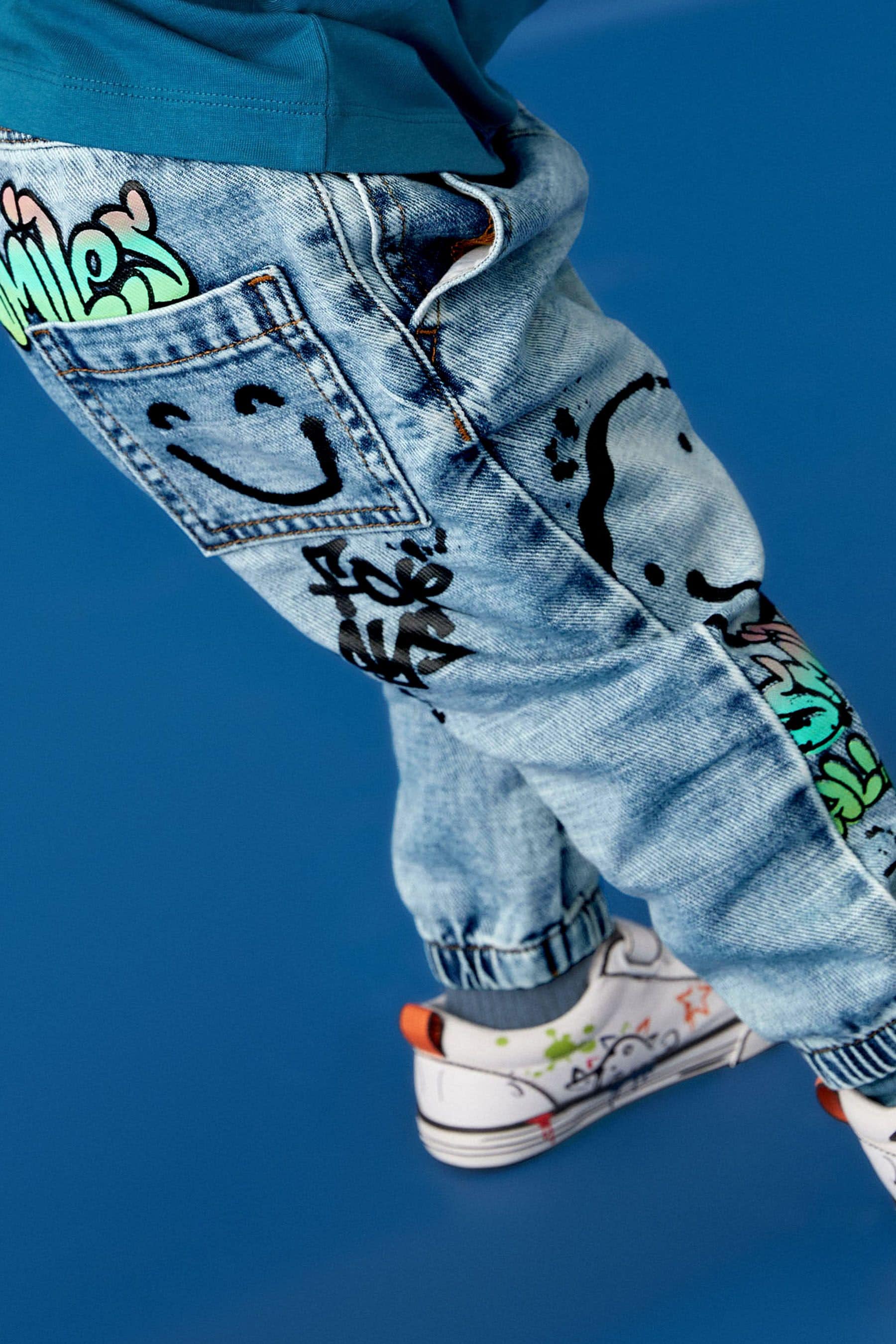 Light Blue Denim 100% Cotton Graffiti Print Jeans (3mths-7yrs)