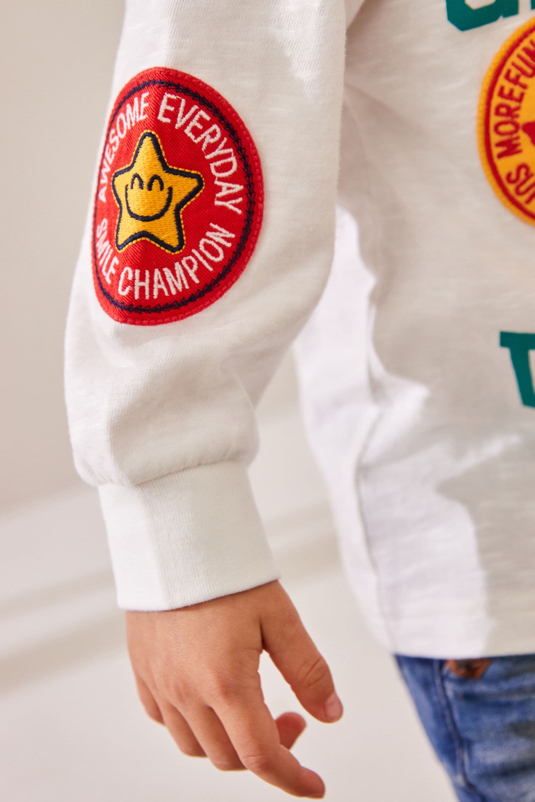 White Badges 100% Cotton Long Sleeve Varsity T-Shirt (3mths-7yrs)