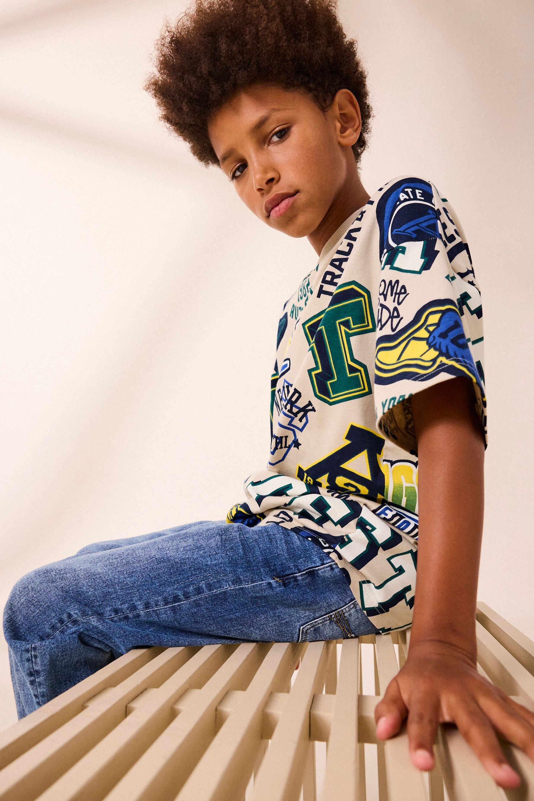 Stone All Over Print Short Sleeve Relaxed Fit Varsity T-Shirt (3-16yrs)