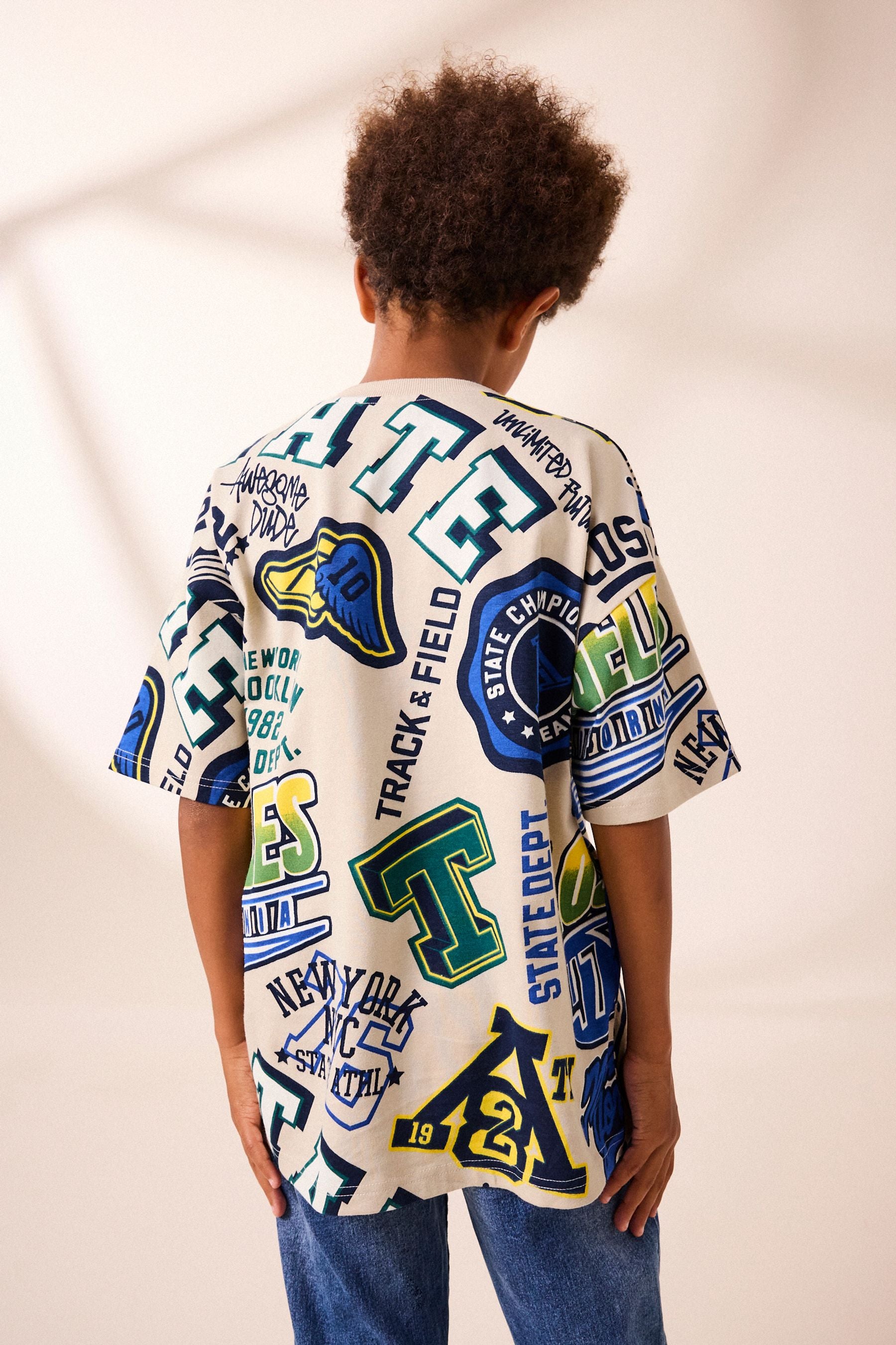 Stone All Over Print Short Sleeve Relaxed Fit Varsity T-Shirt (3-16yrs)