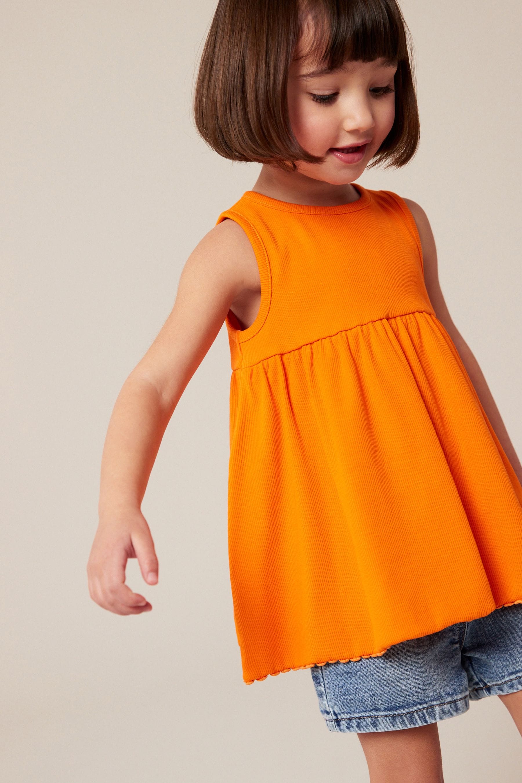 Orange Peplum Ribbed Vest (3mths-7yrs)