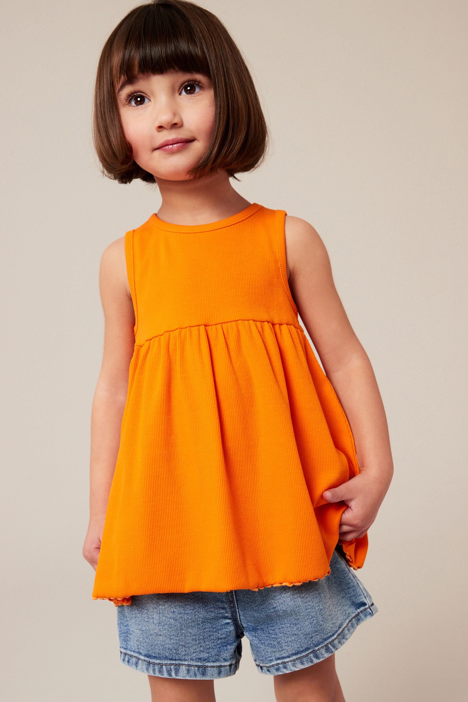 Orange Peplum Ribbed Vest (3mths-7yrs)