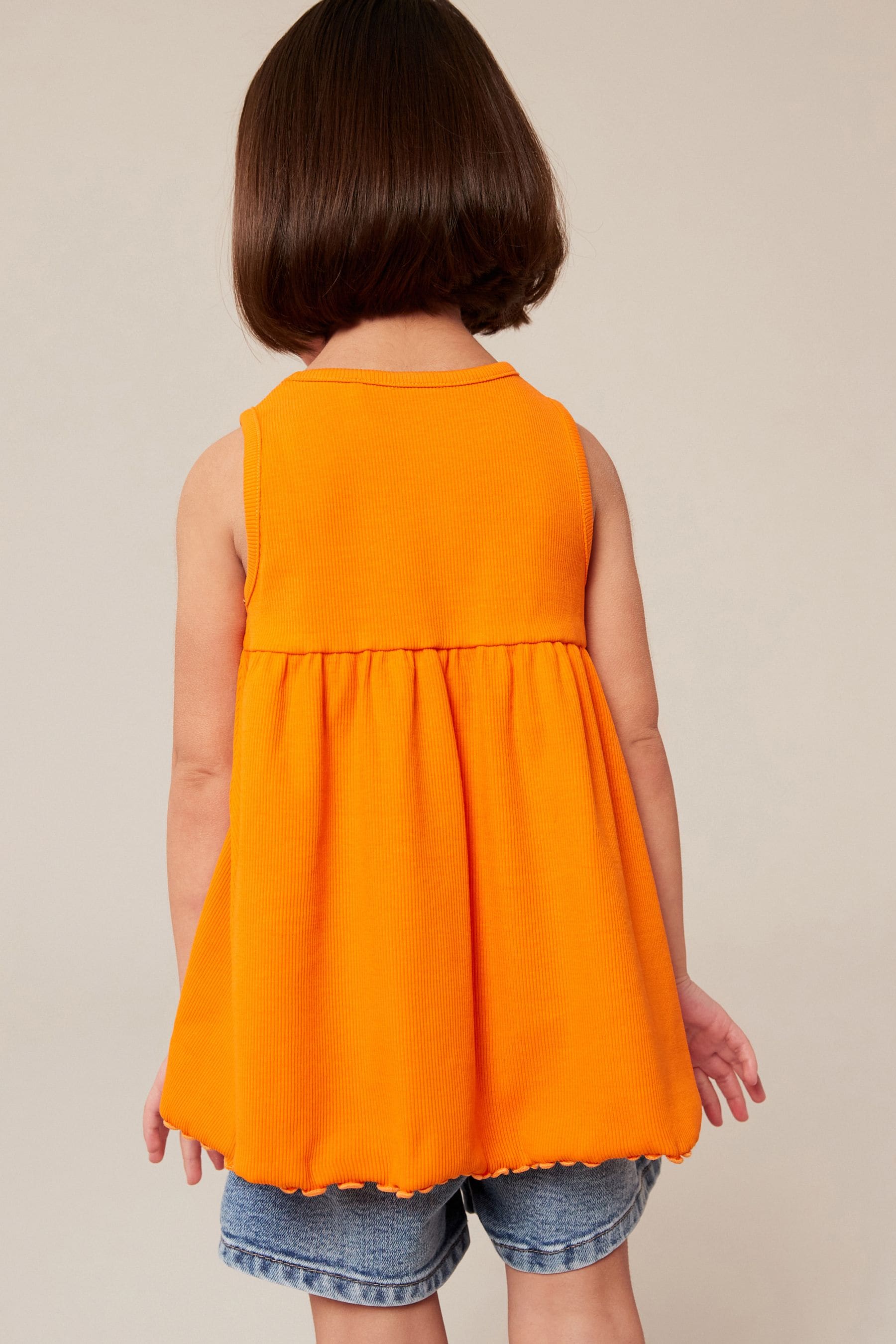 Orange Peplum Ribbed Vest (3mths-7yrs)