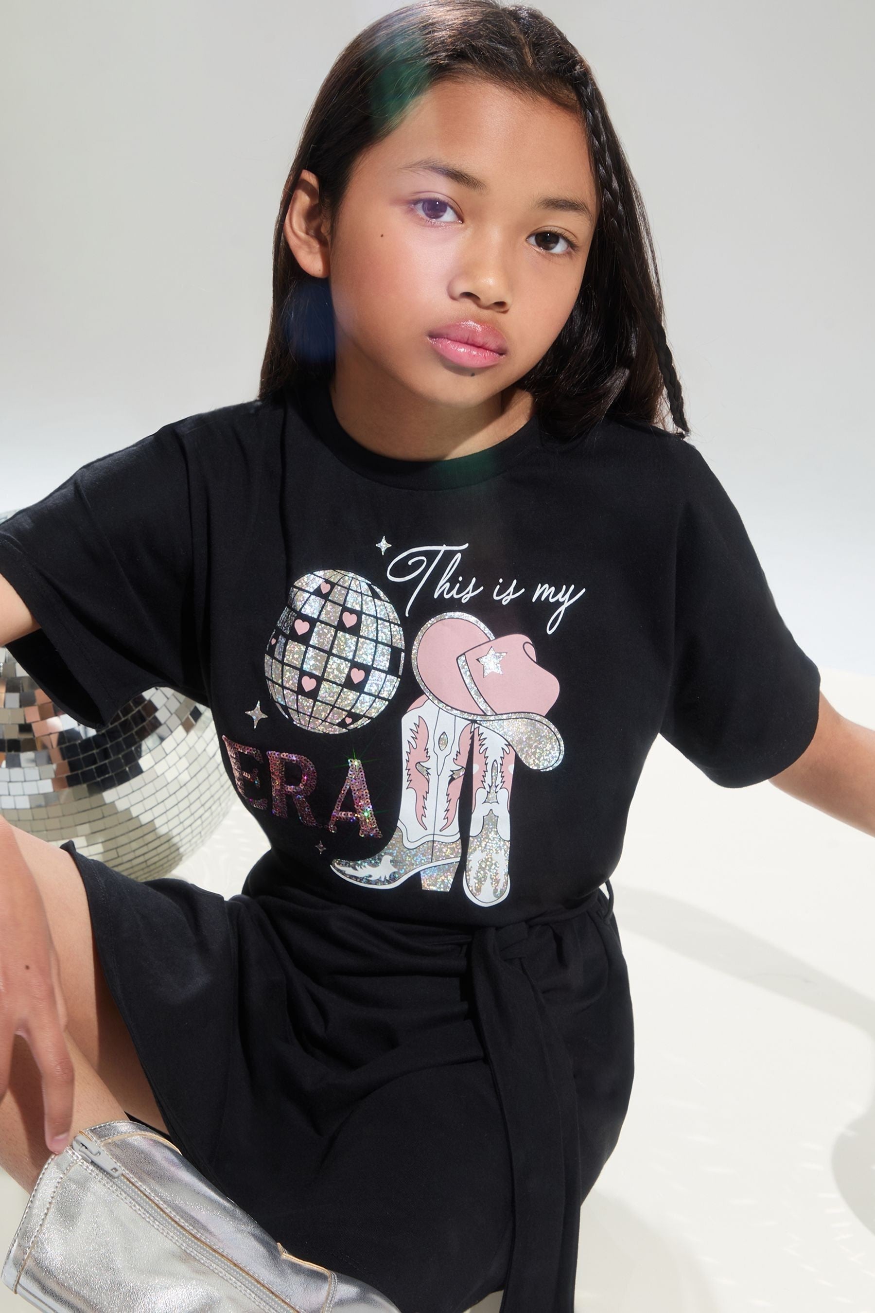 Black Lipsy Era Graphic T-Shirt Dress (4-14yrs)