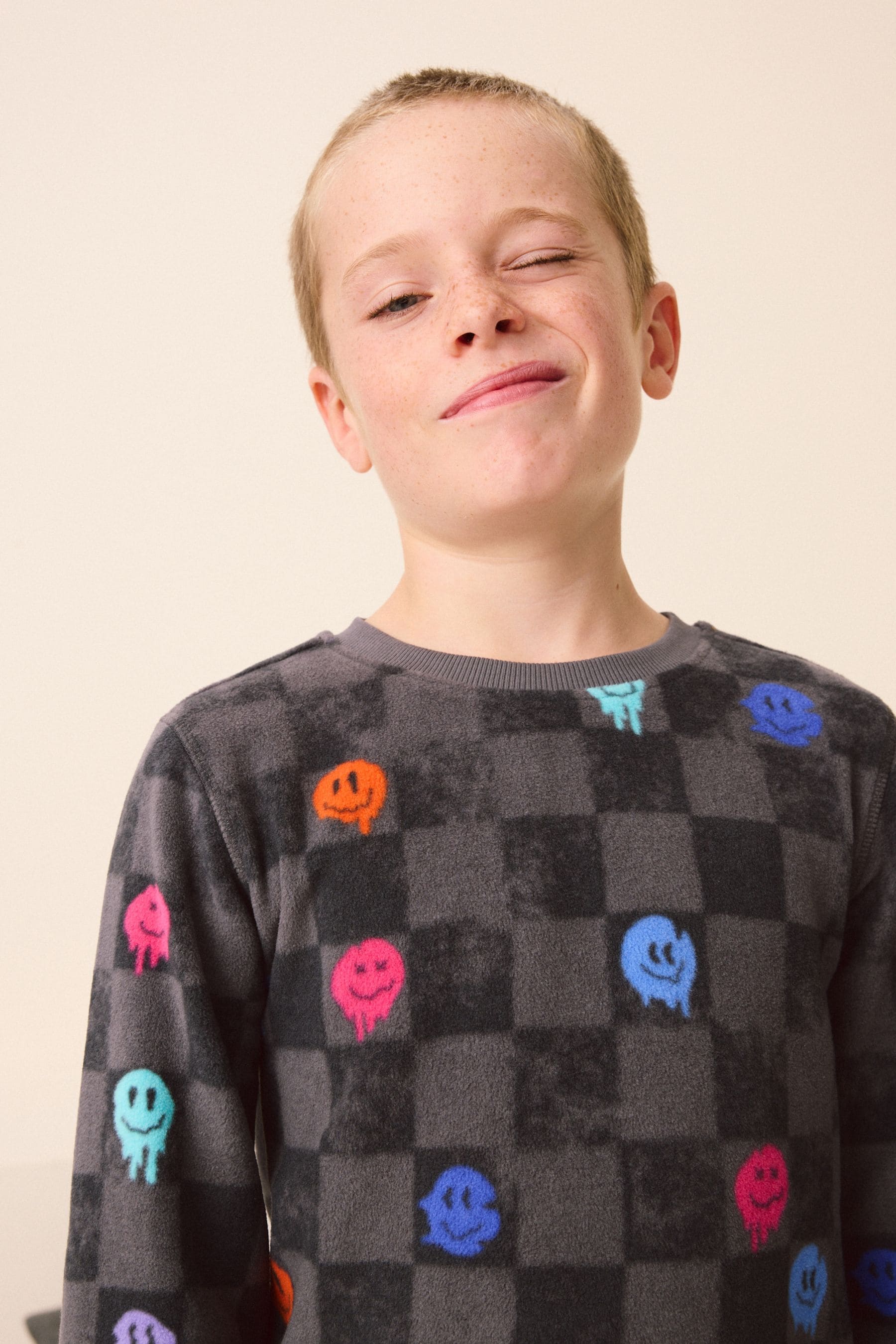 Black/White Checkerboard Smiley Face Single Soft Touch Fleece With Elastane (3-16yrs)