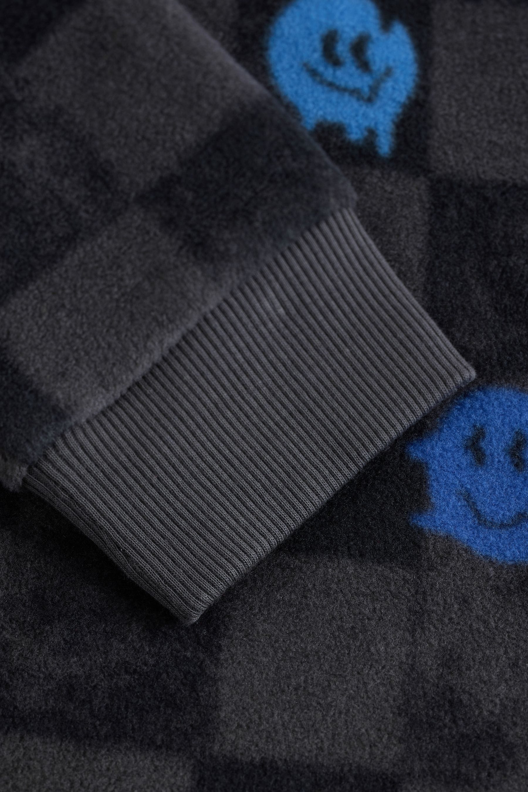 Black/White Checkerboard Smiley Face Single Soft Touch Fleece With Elastane (3-16yrs)