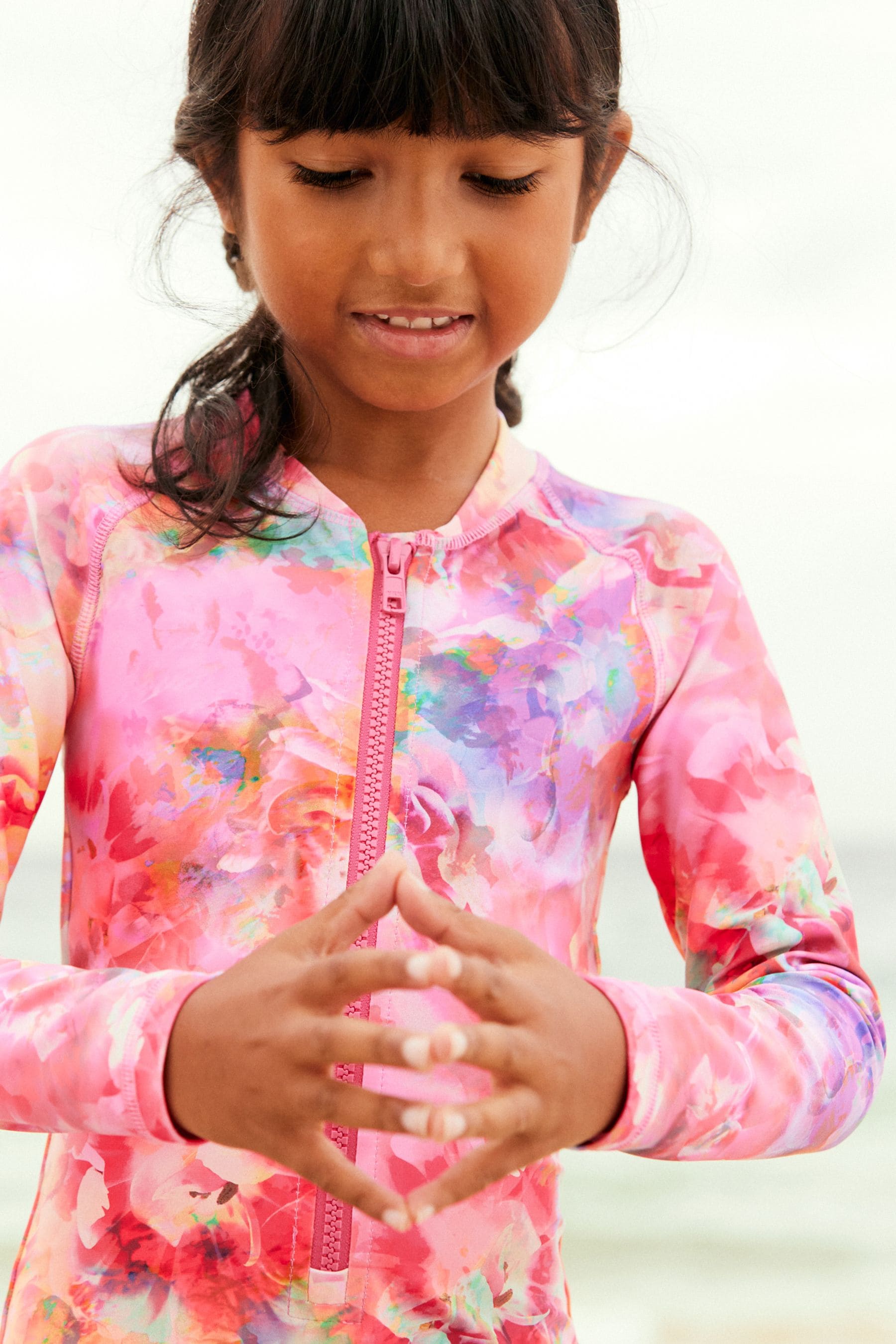 Pink Colour Burst Long Sleeved Shortie Swimsuit (3-16yrs)