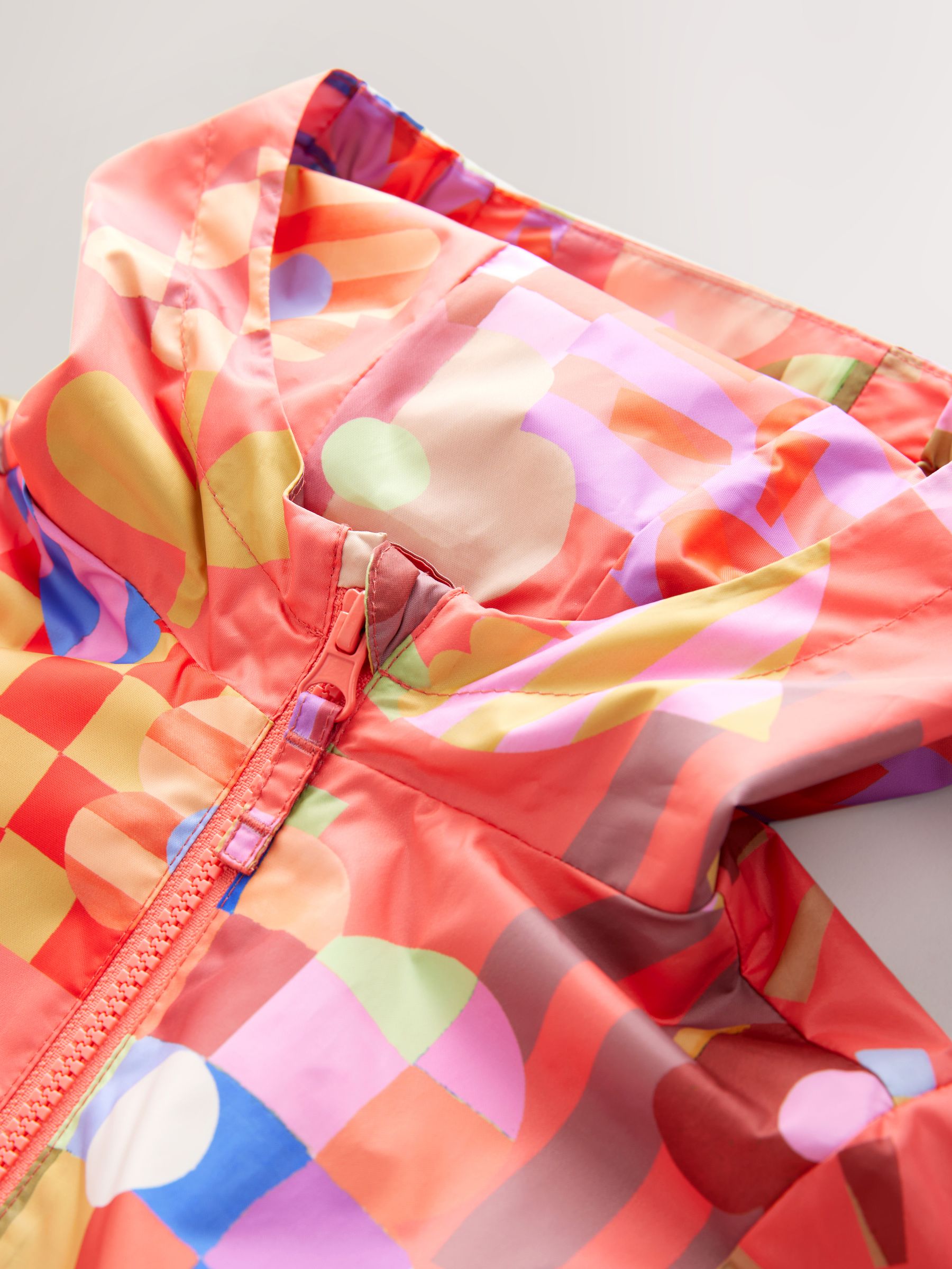 Multi Bright Shower Resistant Printed Cagoule Jacket (3mths-7yrs)