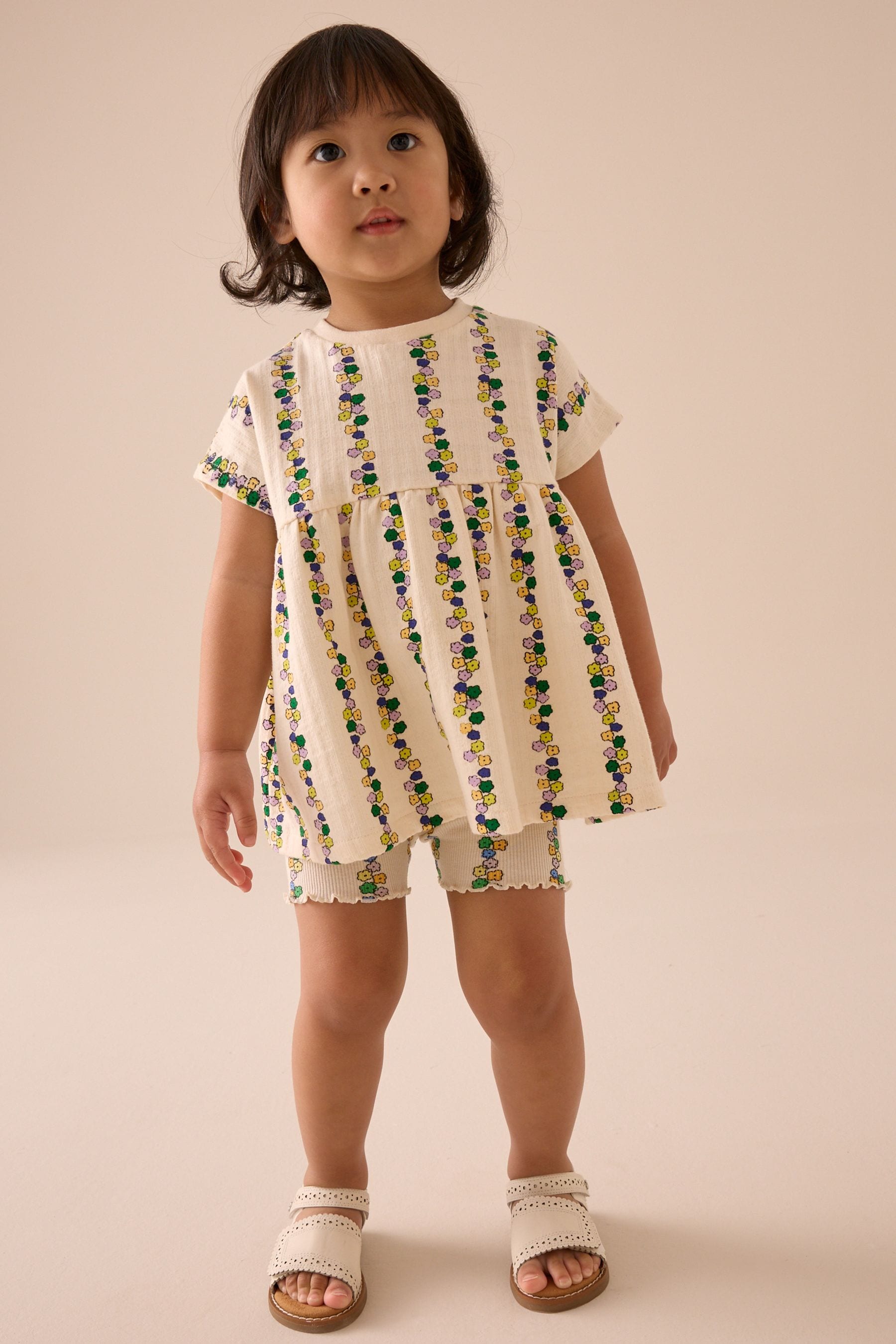 Cream Flowers Short Sleeve Peplum Top and Cycle Shorts Set (3mths-7yrs)