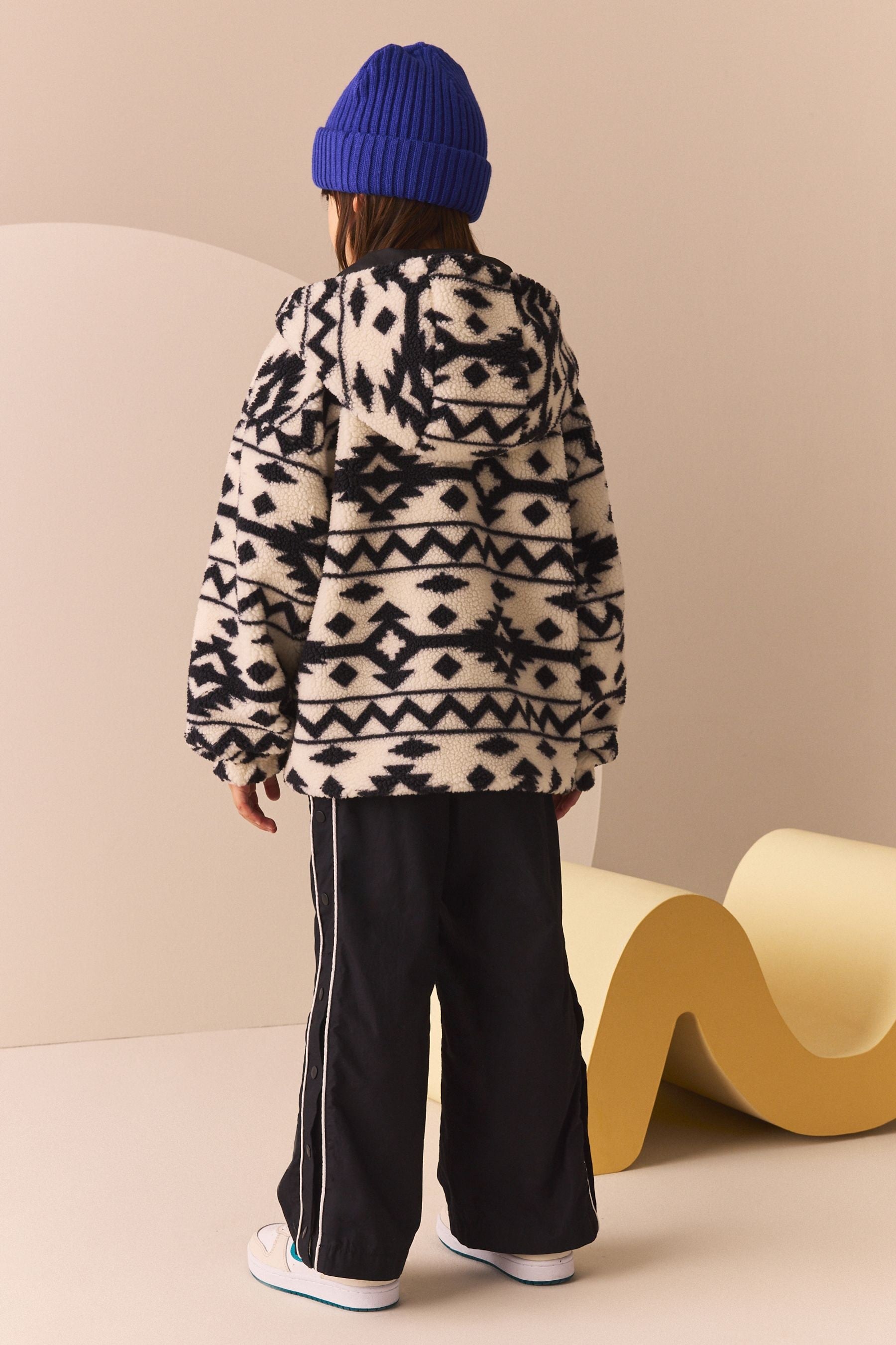 Black/White Reversible Aztec Printed Borg Fleece and Nylon Jacket (3-12yrs)