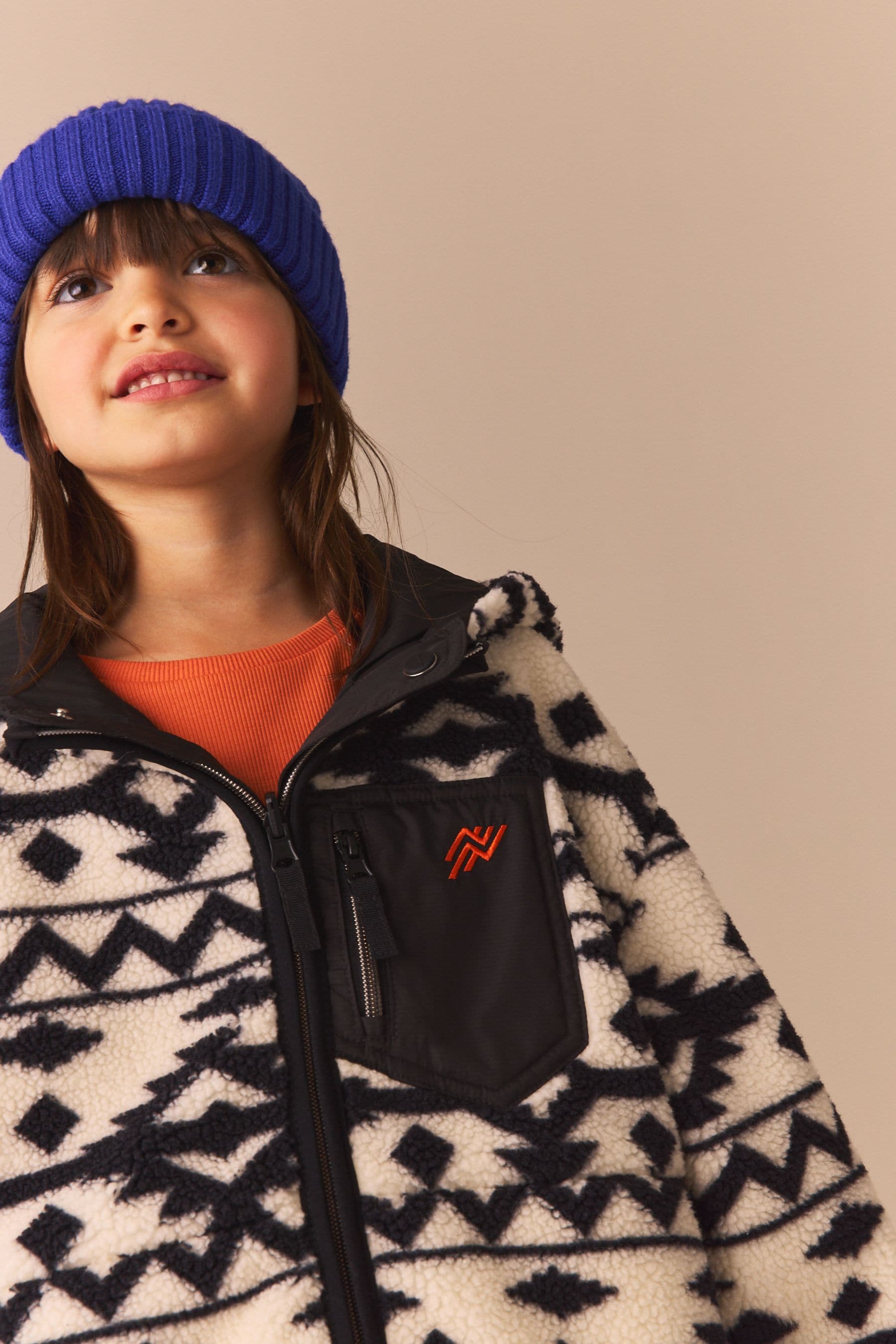 Black/White Reversible Aztec Printed Borg Fleece and Nylon Jacket (3-12yrs)