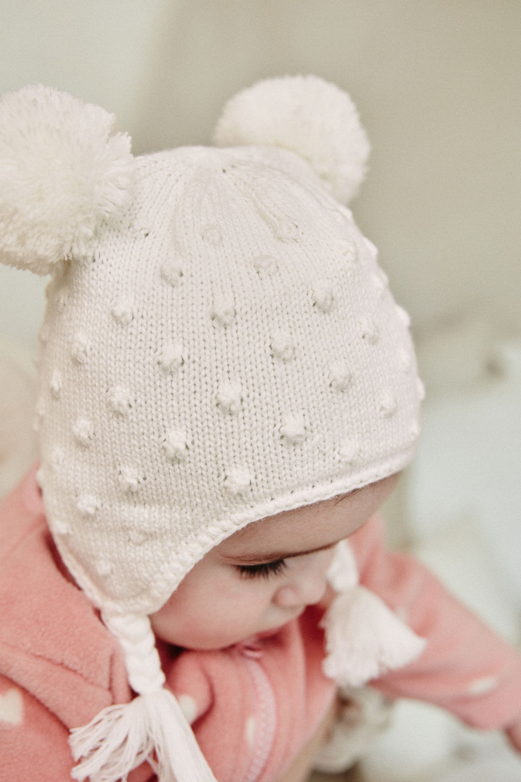 Ecru Double Pom Knitted Trapper Hat (0mths-2yrs)