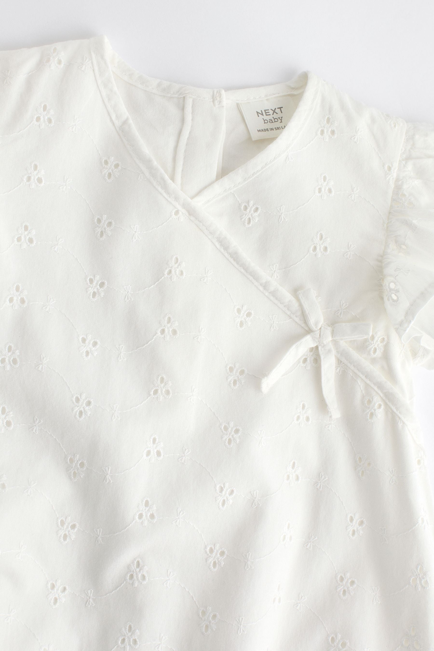 White Broderie Baby Wrap Romper (0mths-3yrs)