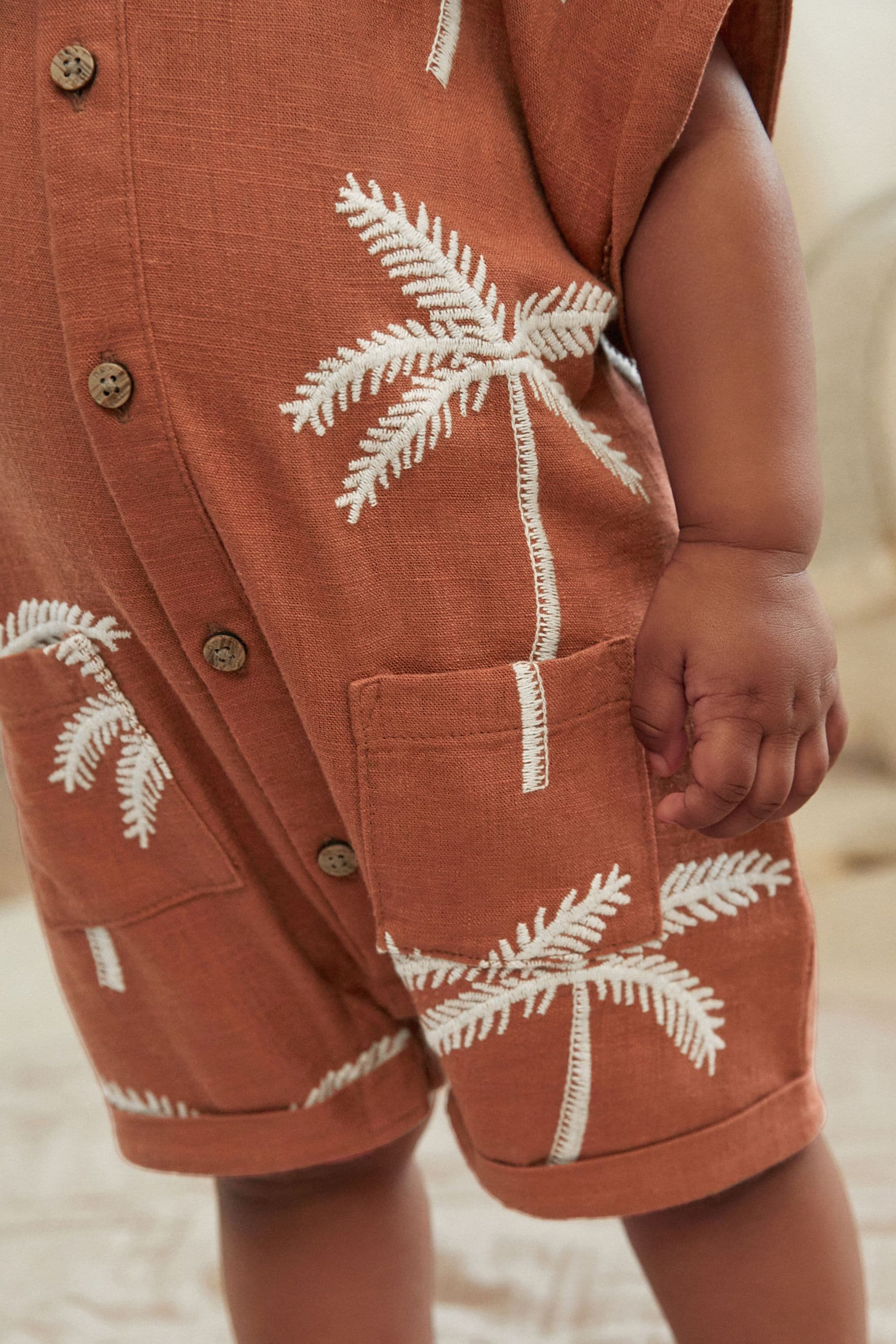 Rust Palm Tree Woven Baby Romper (0mths-2yrs)