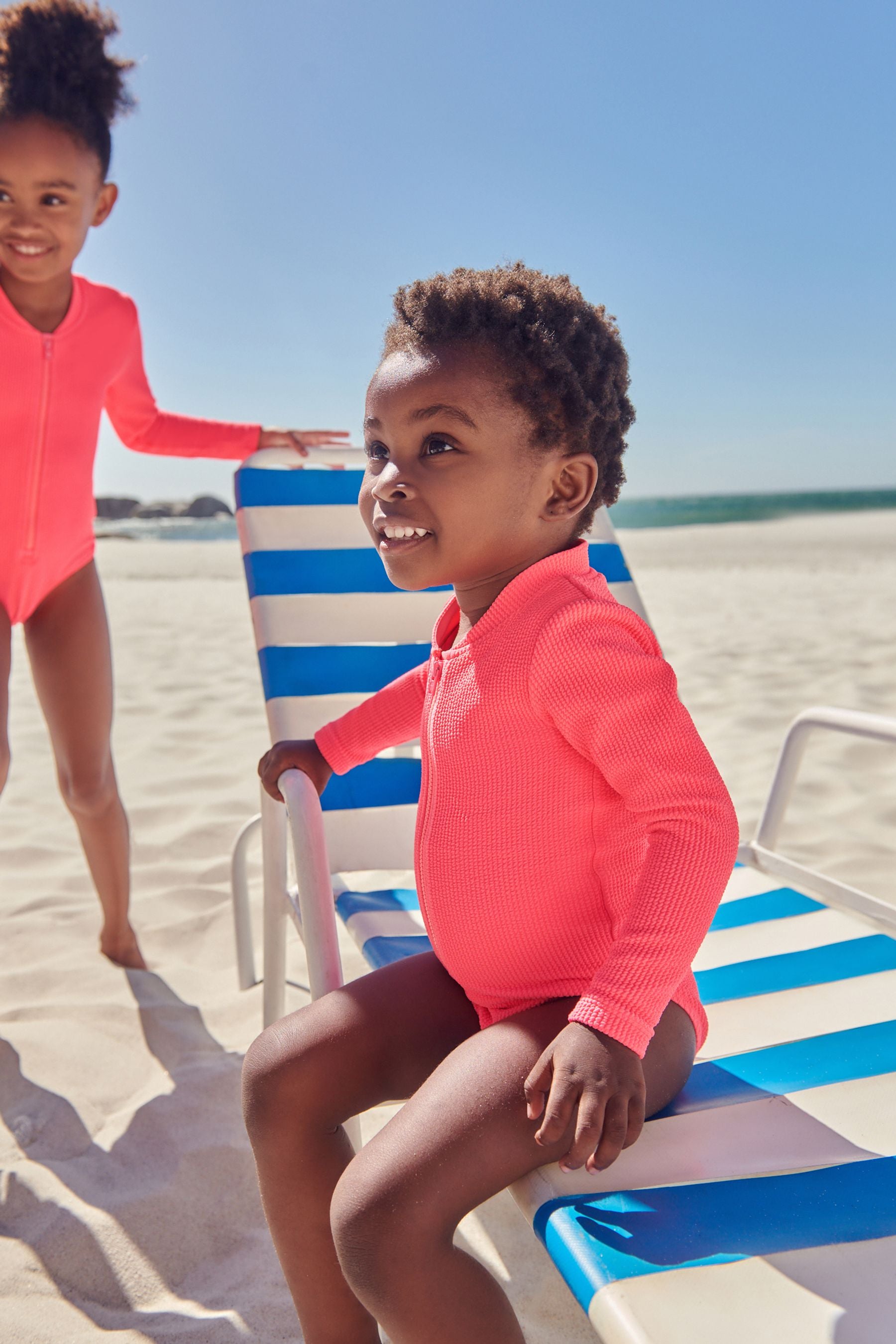 Fluro Pink Long Sleeve Textured Swimsuit (3mths-16yrs)