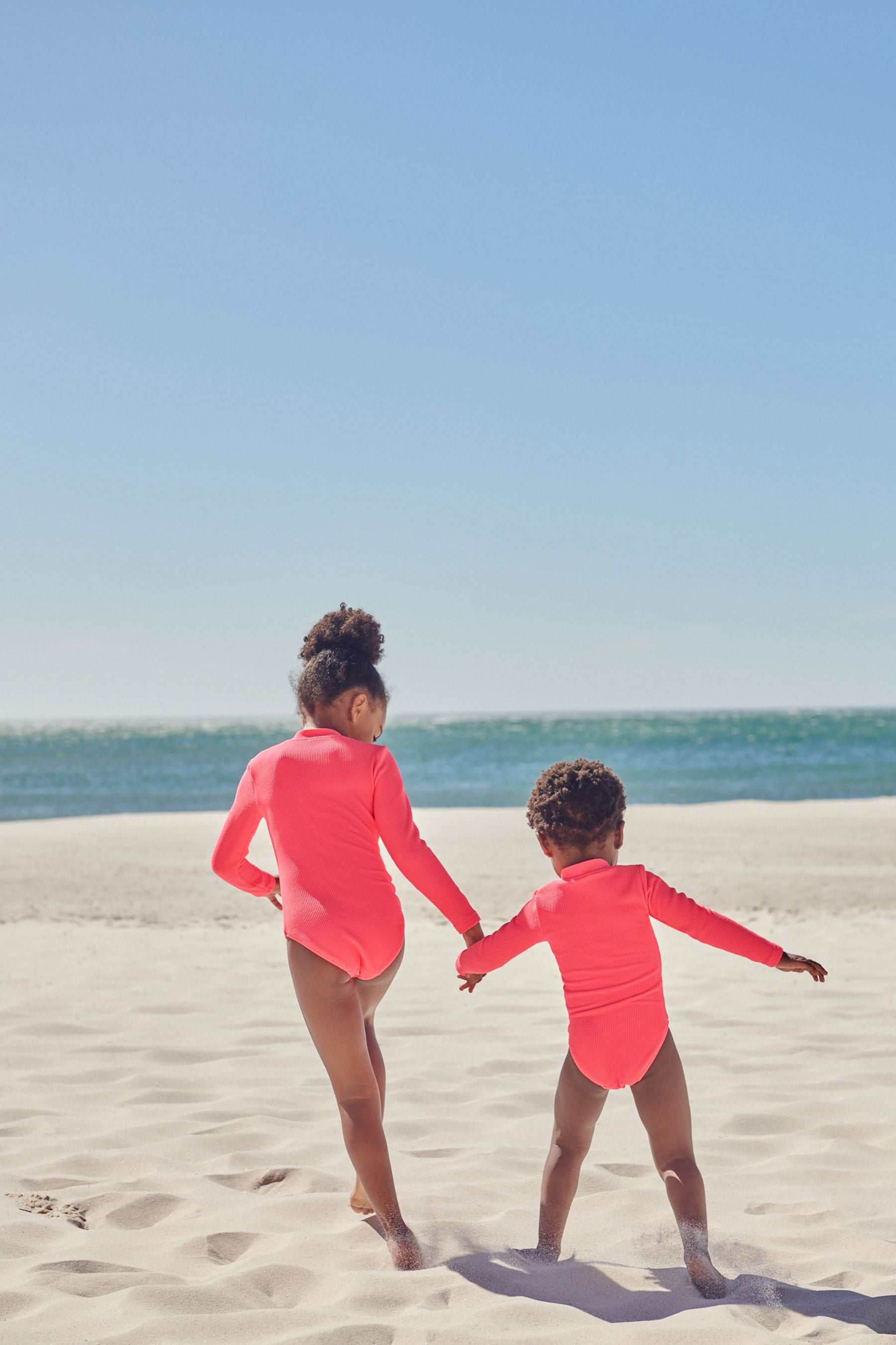 Fluro Pink Long Sleeve Textured Swimsuit (3mths-16yrs)