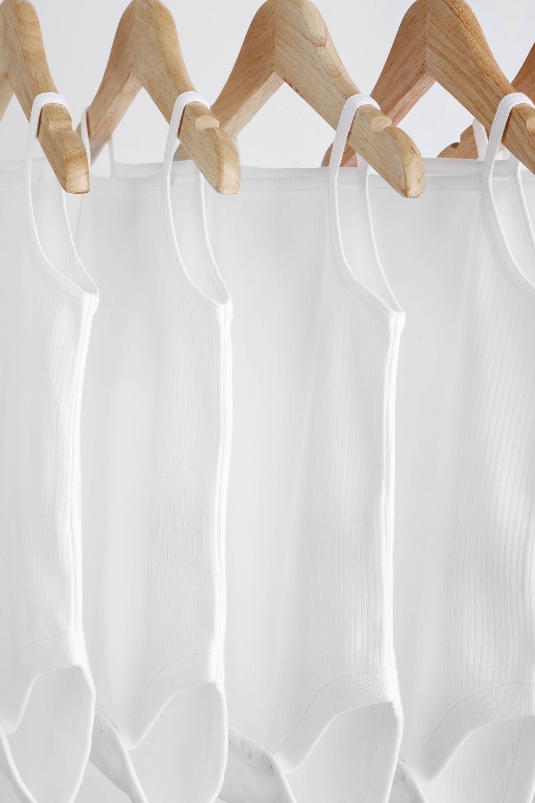 White 5 Pack Baby Strappy Bodysuits