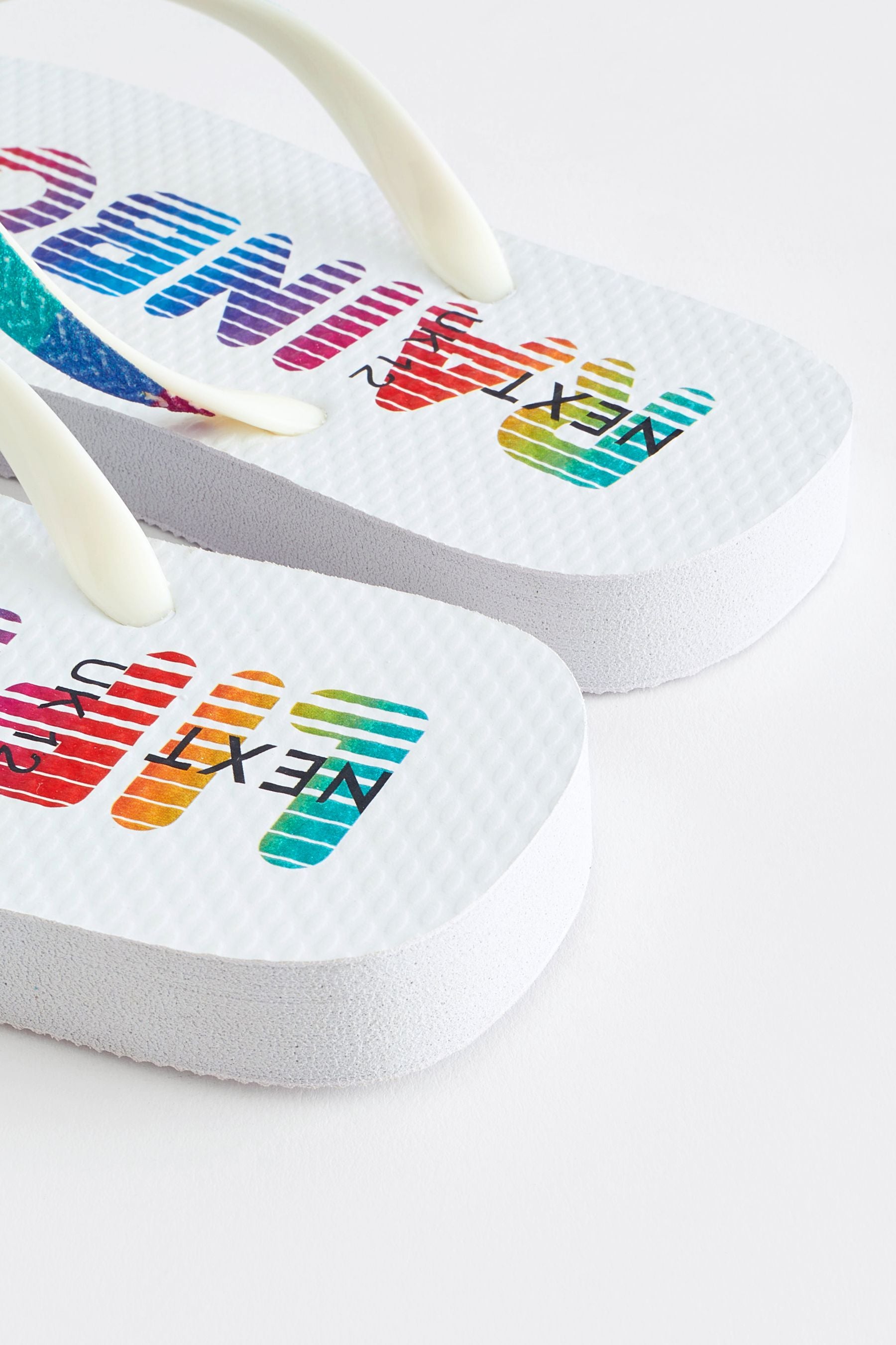 White Rainbow Flip Flops