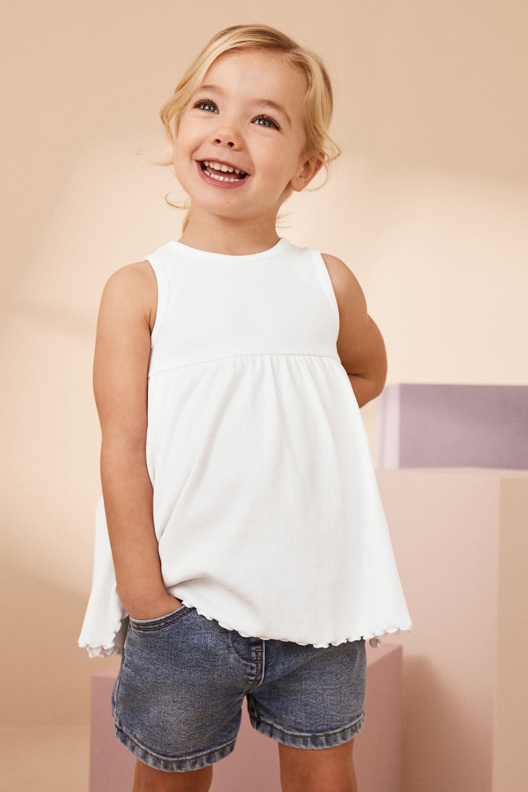 White Peplum Ribbed Vest (3mths-7yrs)