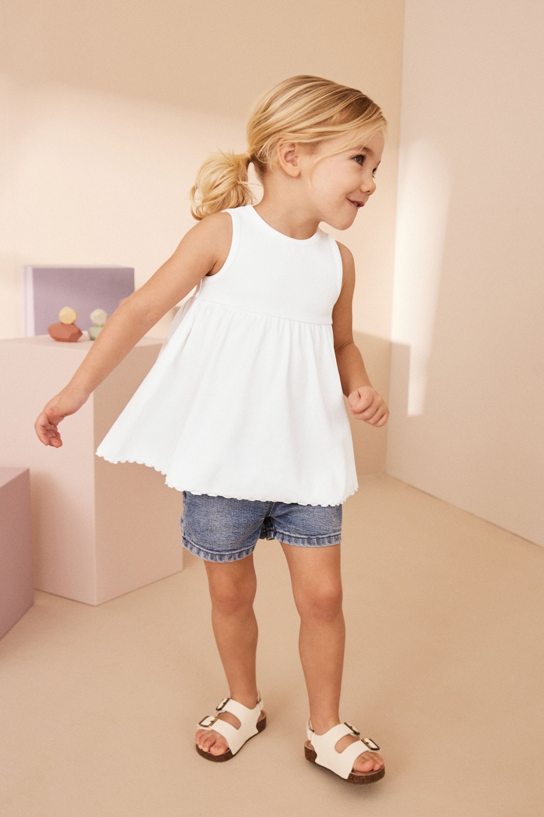 White Peplum Ribbed Vest (3mths-7yrs)