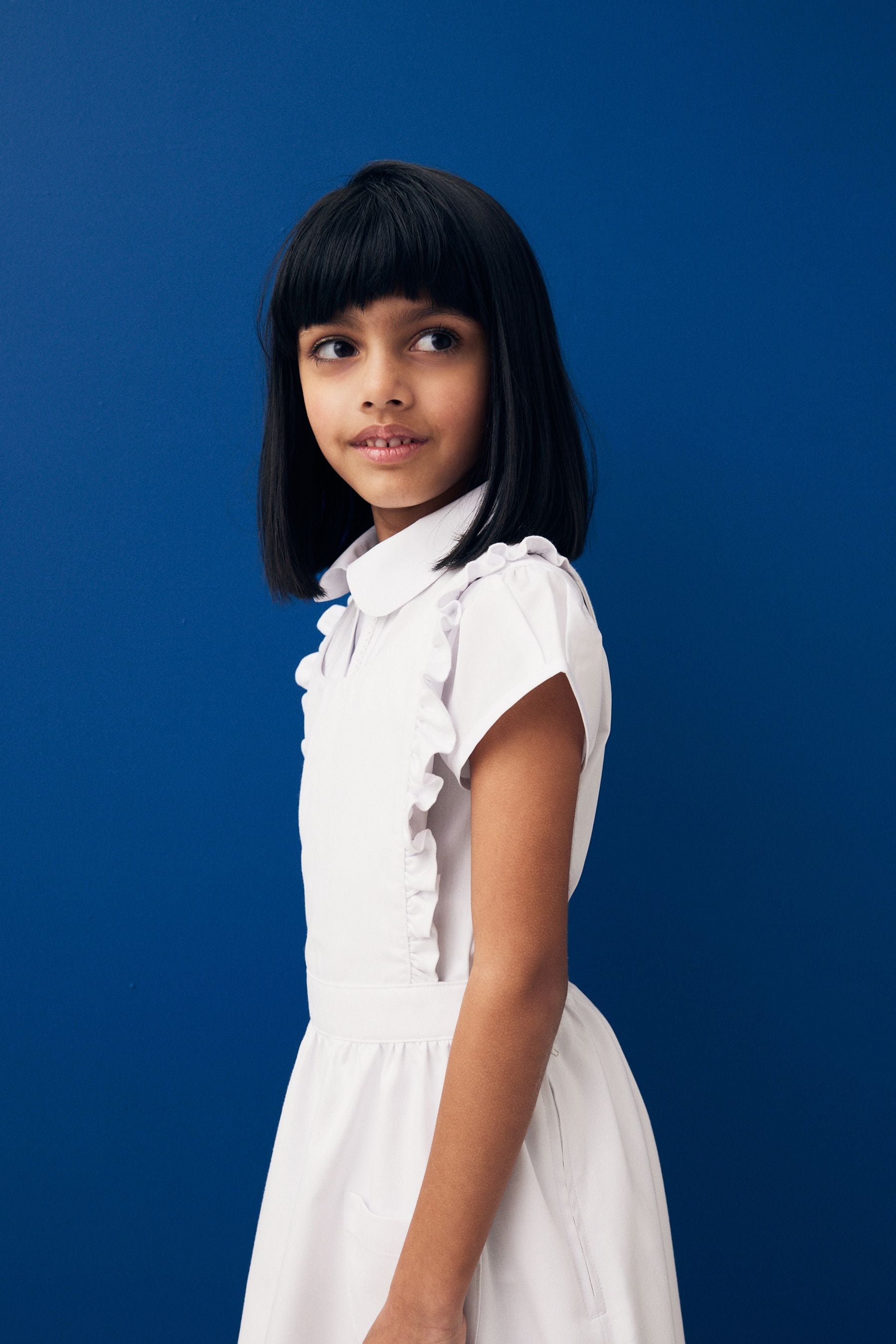 White Ruffle Detail Pinafore School Dress (3-14yrs)