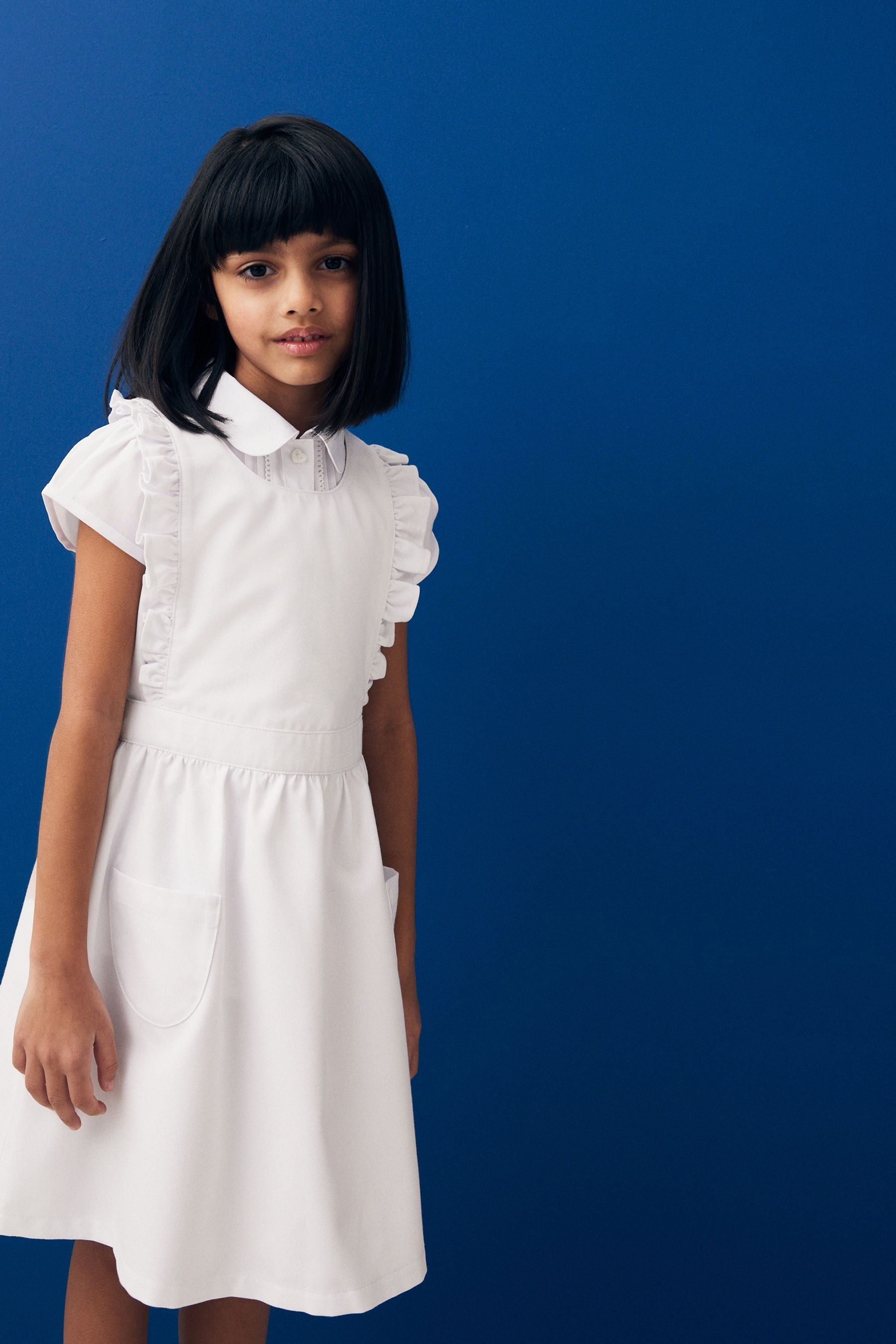 White Ruffle Detail Pinafore School Dress (3-14yrs)