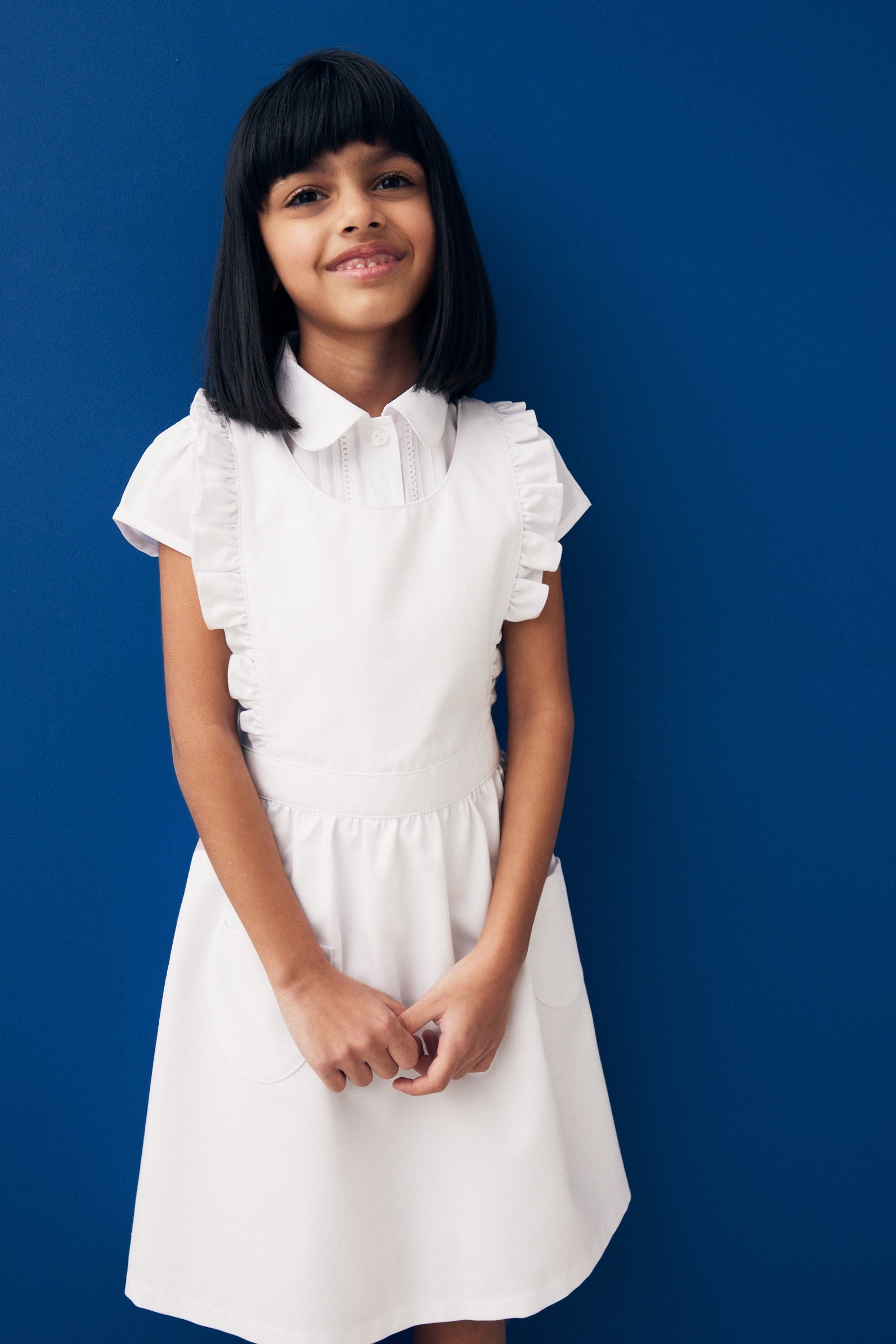 White Ruffle Detail Pinafore School Dress (3-14yrs)