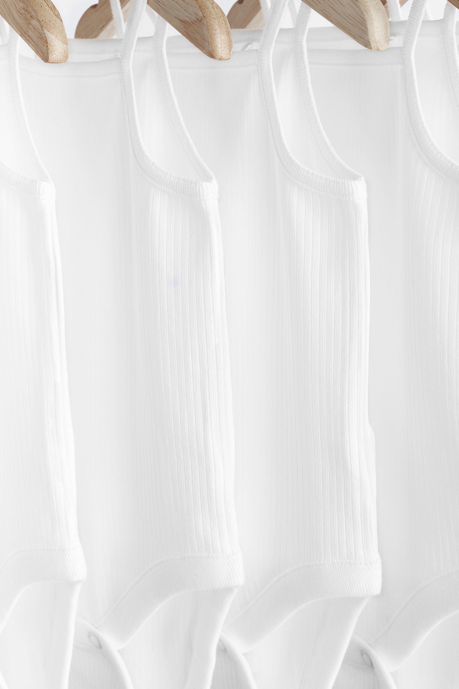 White 7 Pack Baby Strappy Bodysuits