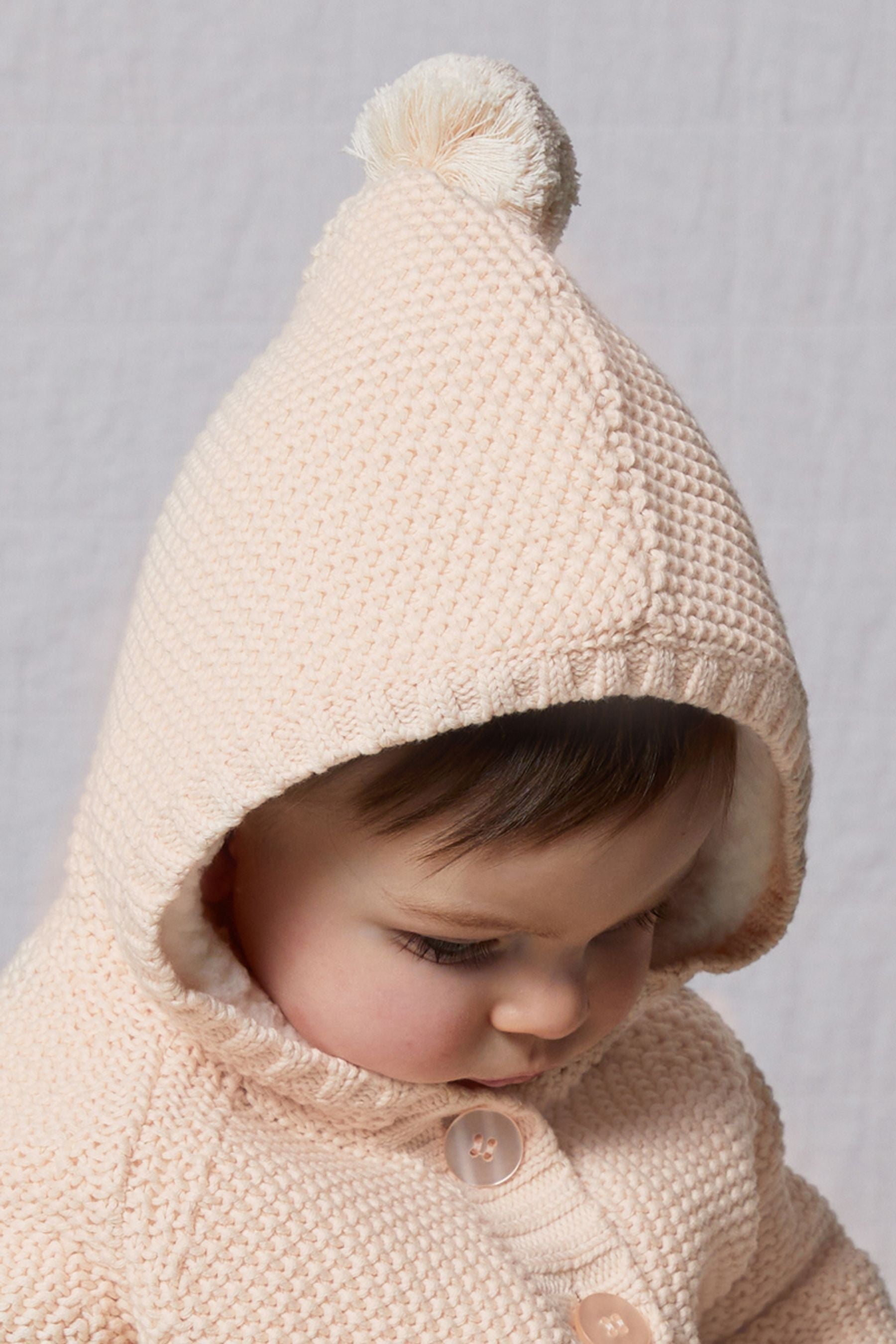 The Little Tailor Baby Pixie Pram Coat with Plush Lining and Pom Pom