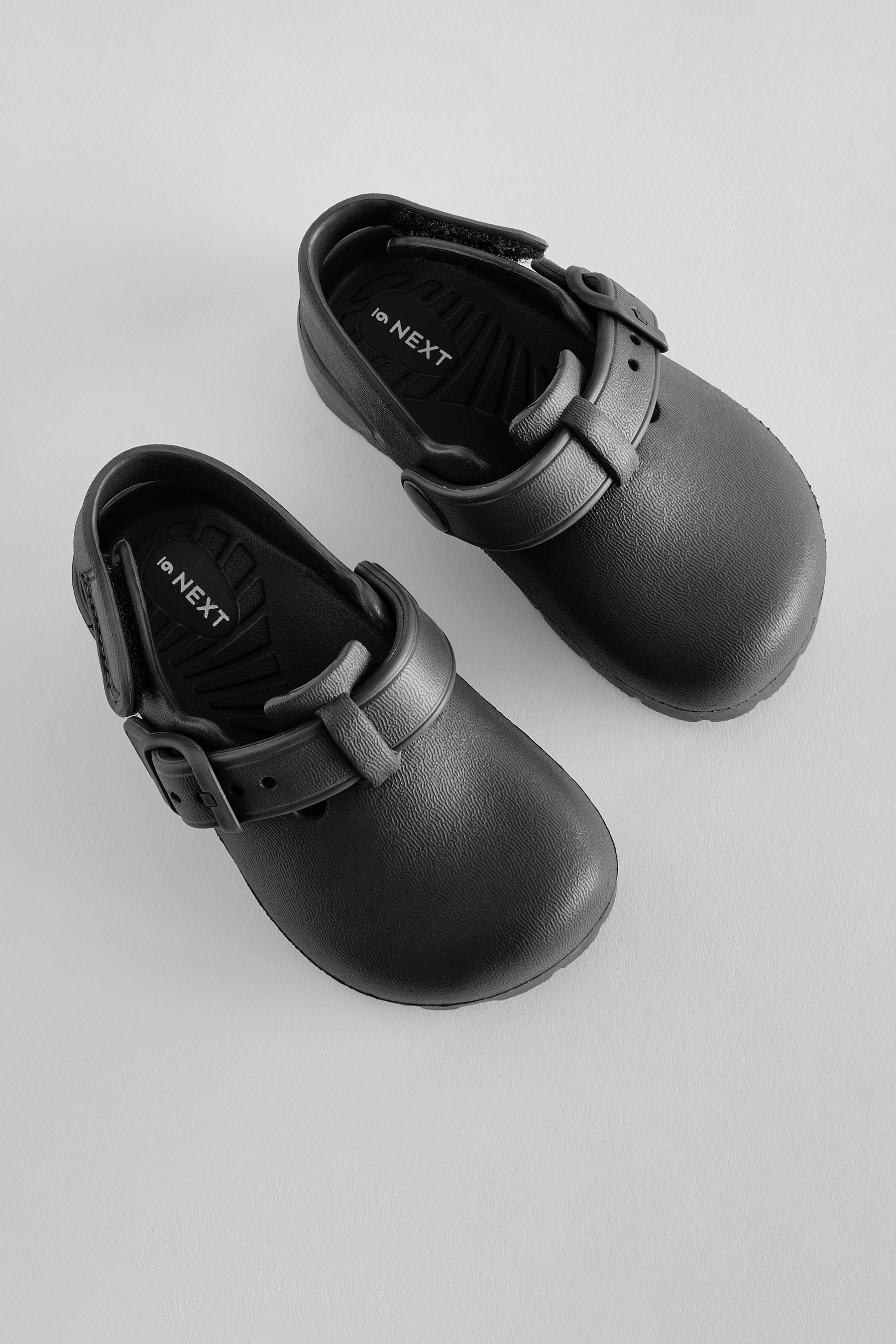 Black Buckle Clogs