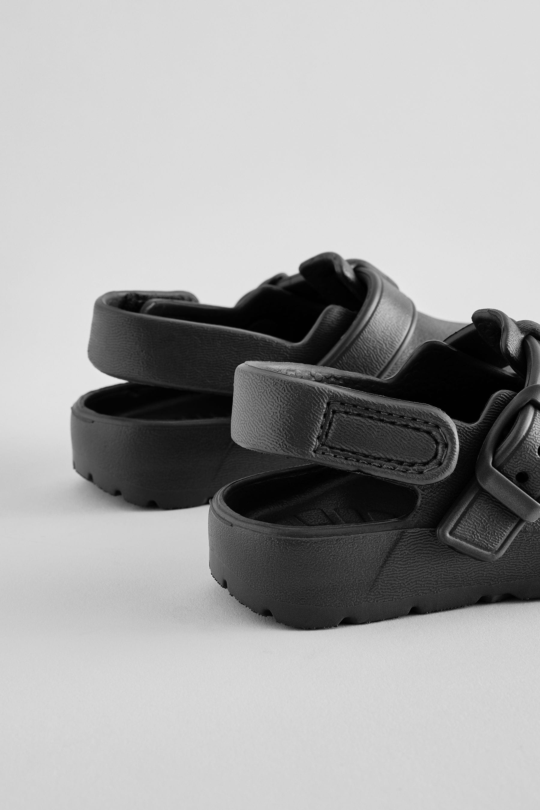 Black Buckle Clogs