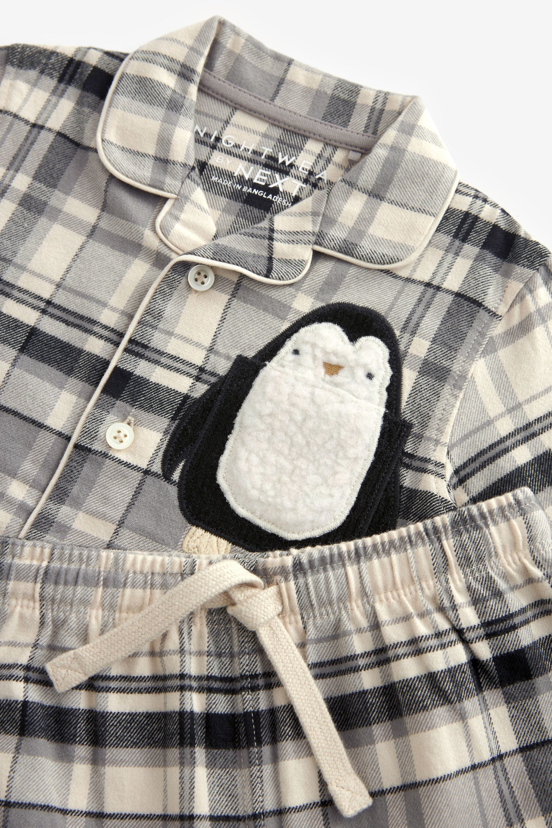 Neutral/Black Penguin Button Down Pyjamas (9mths-8yrs)