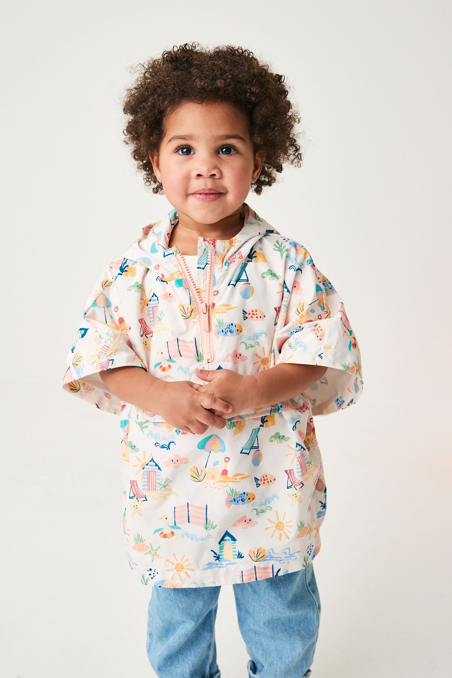 Cream Character Beach Shower Resistant Overhead Printed Pack Away Poncho Cagoule (3mths-7yrs)