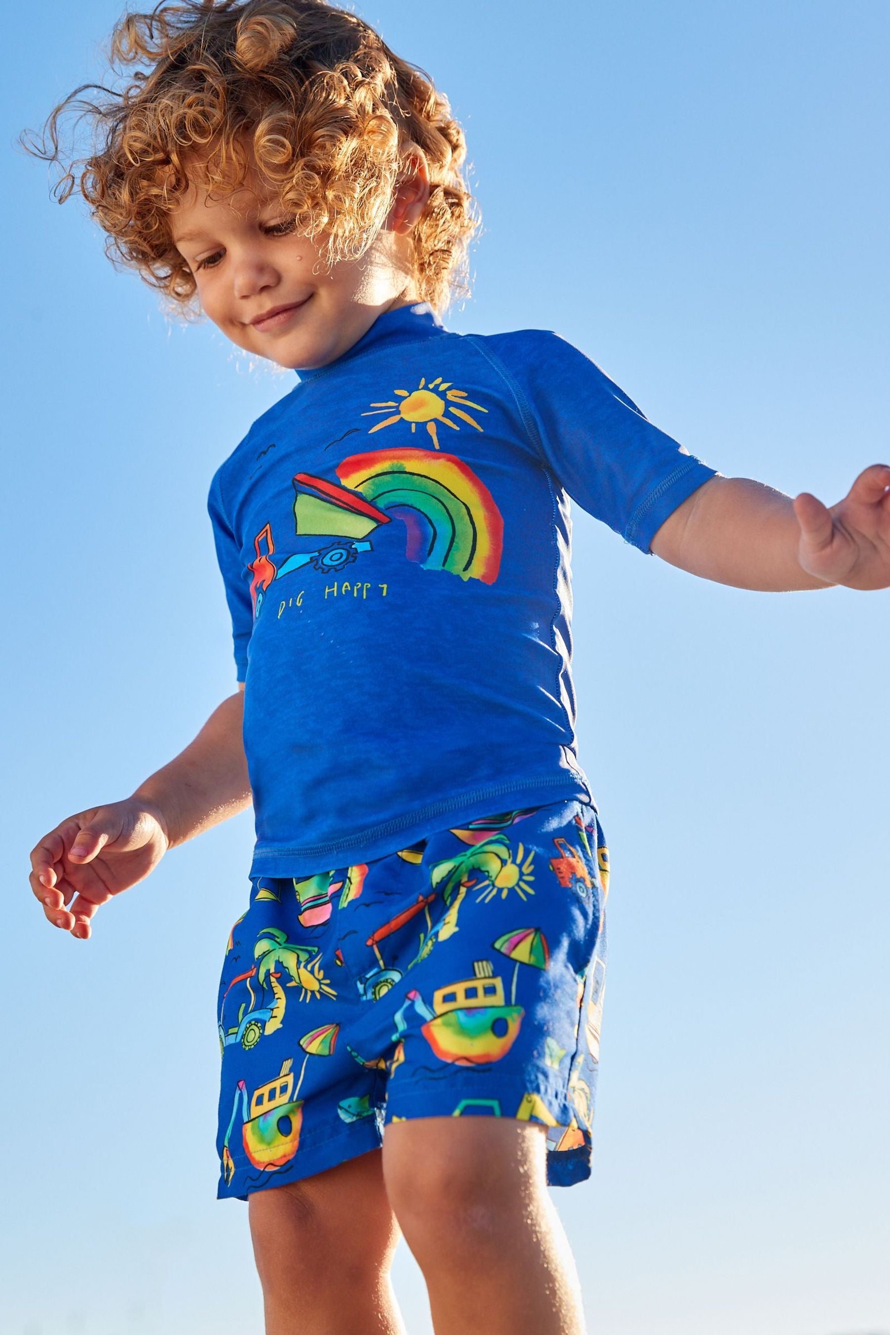 Blue Rainbow Digger 2 Piece Rash Vest And Shorts Set (3mths-7yrs)