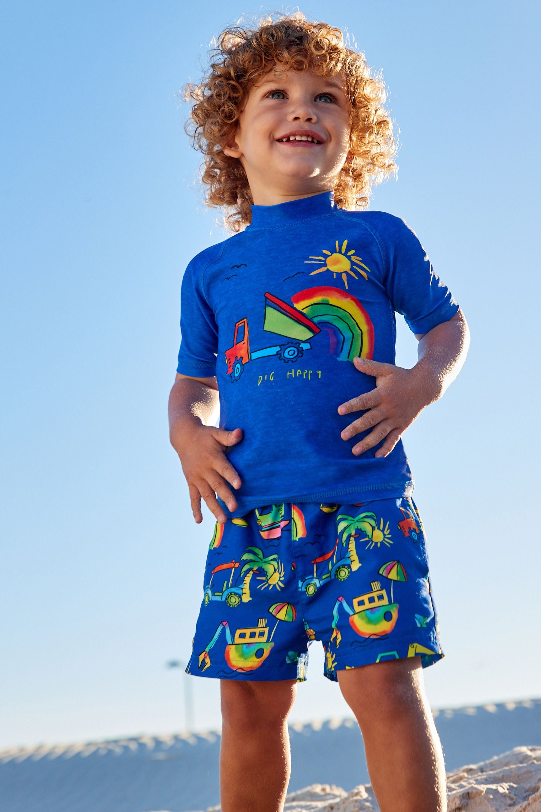 Blue Rainbow Digger 2 Piece Rash Vest And Shorts Set (3mths-7yrs)