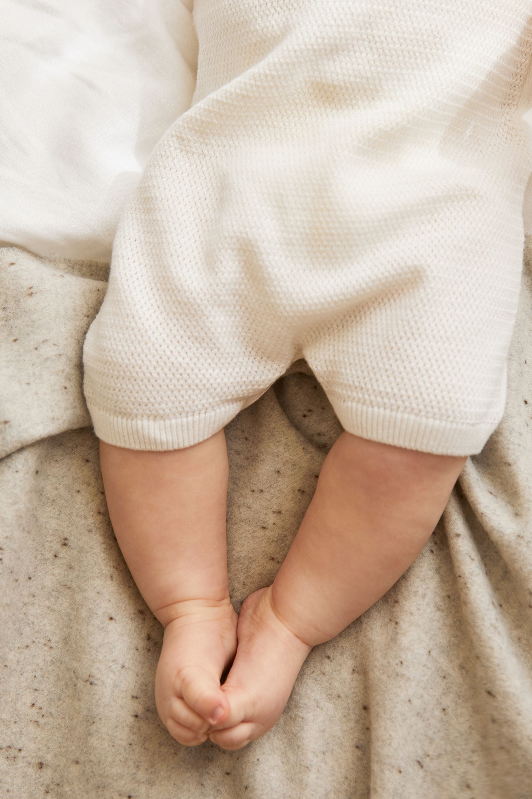 White Baby Knitted Rompersuit (0mths-2yrs)