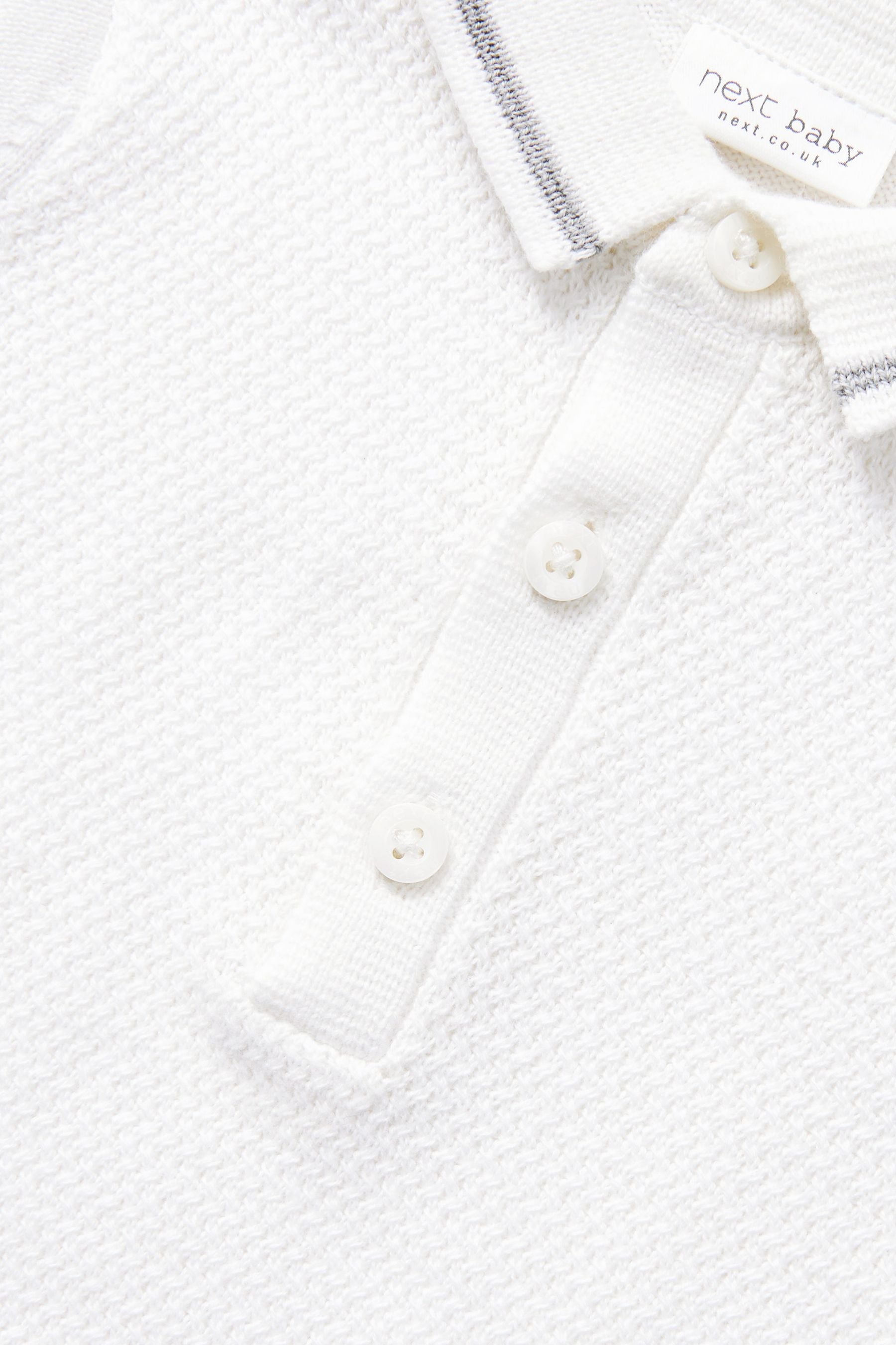 White Baby Knitted Rompersuit (0mths-2yrs)