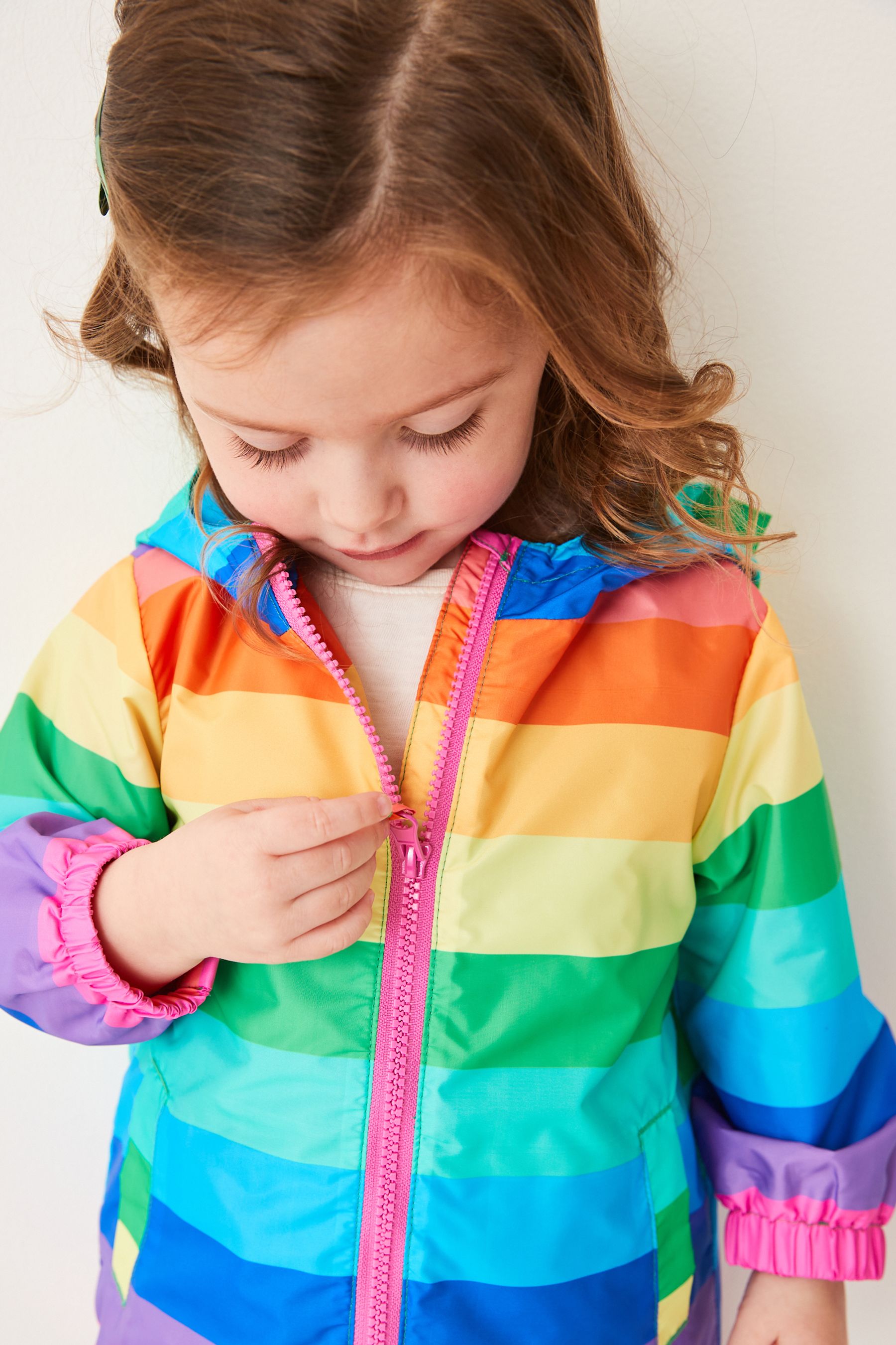 Multi Rainbow Shower Resistant Printed Cagoule Jacket (3mths-7yrs)