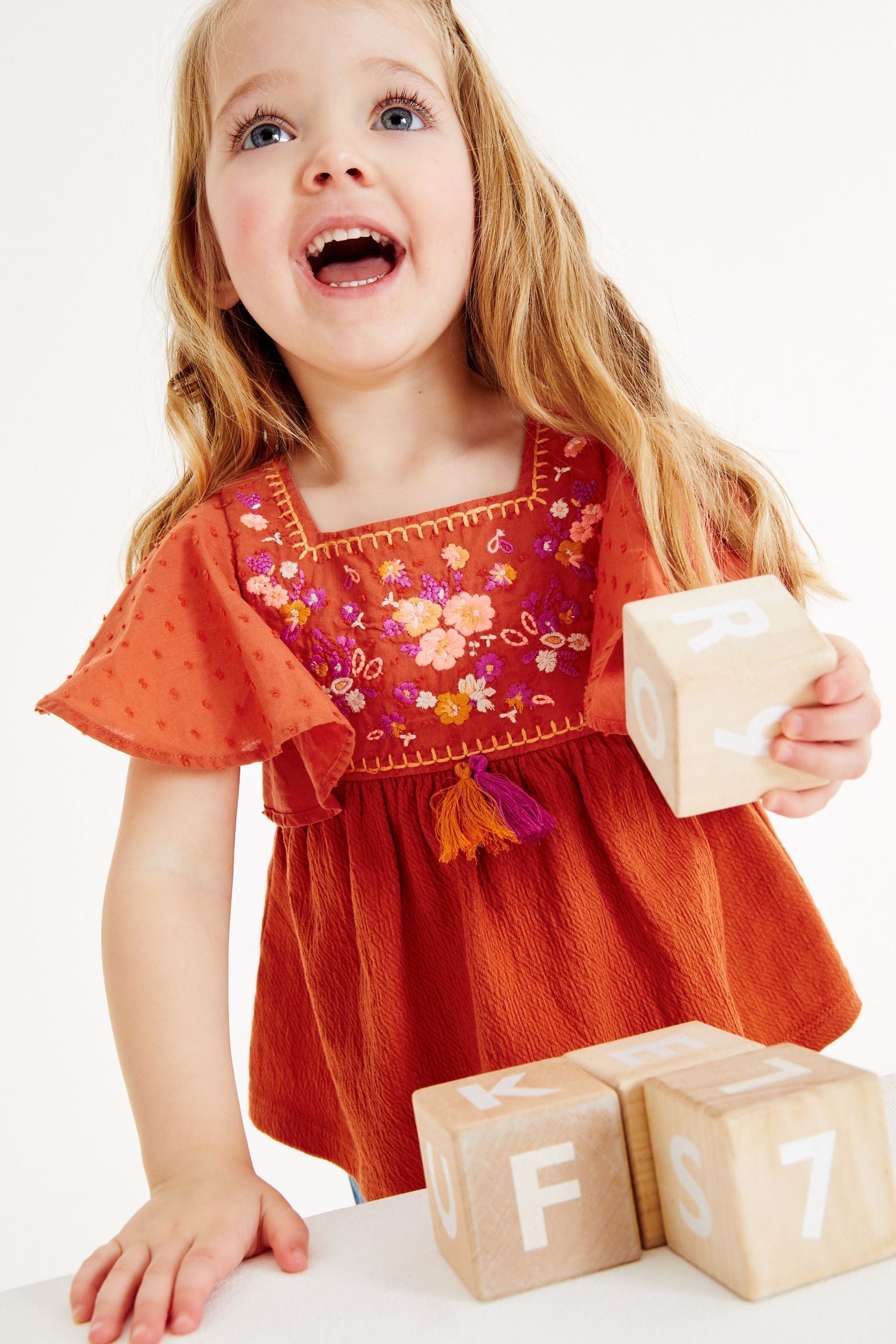 Burnt Orange Jersey Tassel Blouse (3mths-7yrs)