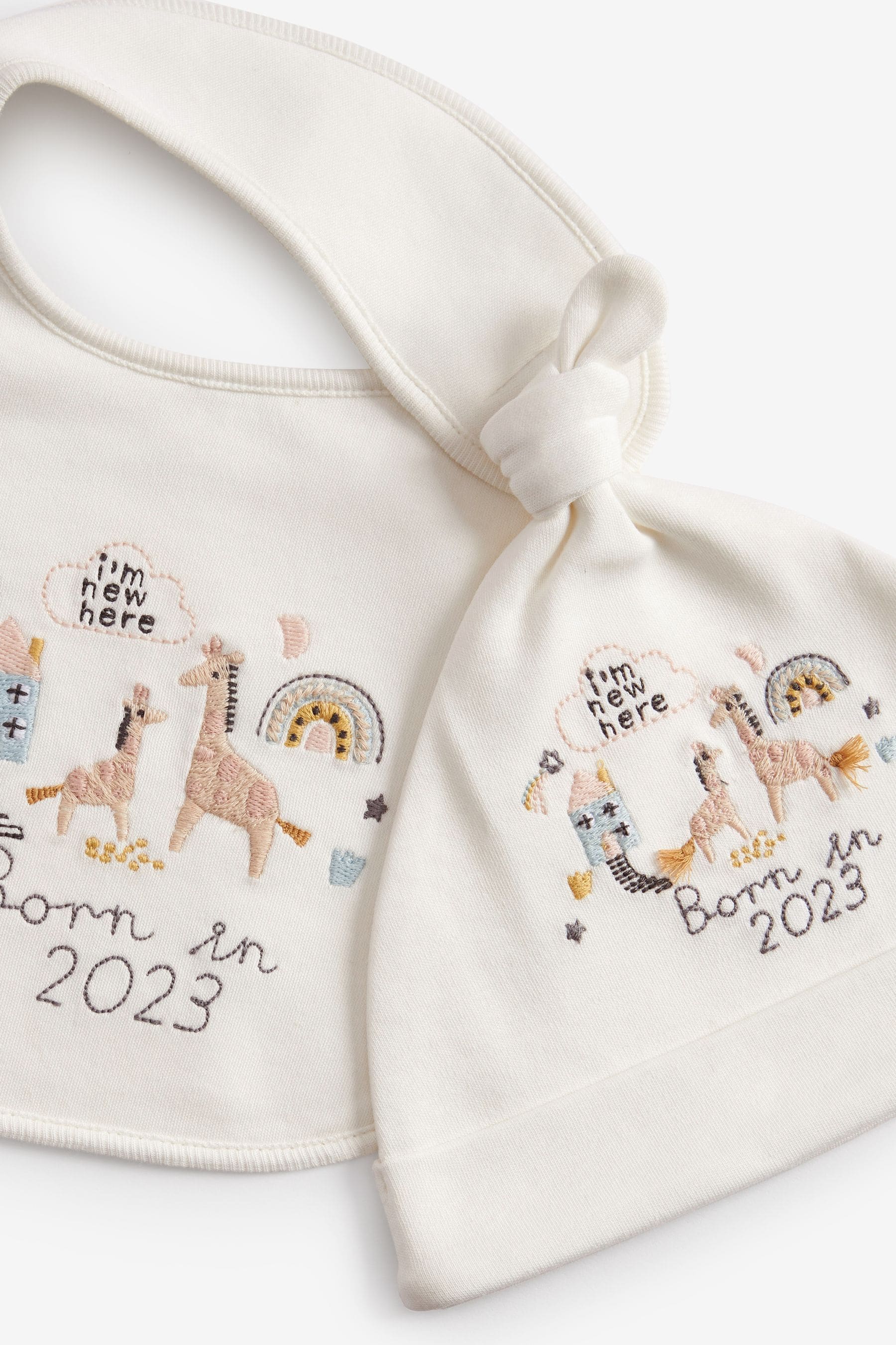 White Born In 2023 Baby Hat And Bib Set (0-12mths)